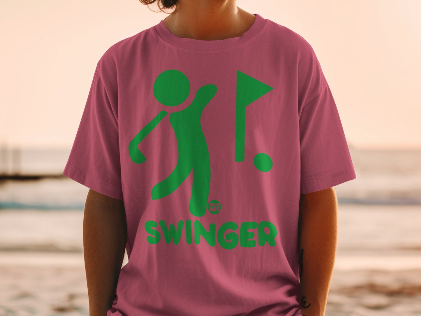 Pink t-shirt with green golfer graphic and "SWINGER" text.