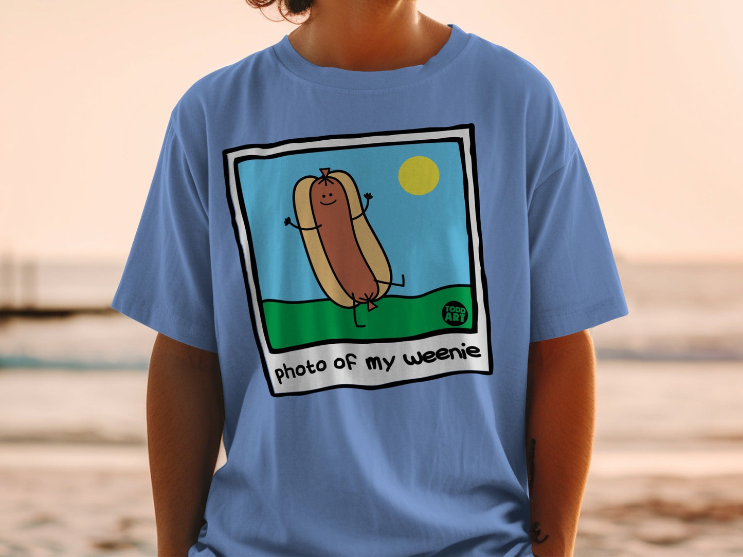Cartoon hot dog with arms and legs in a sun and grass illustration.