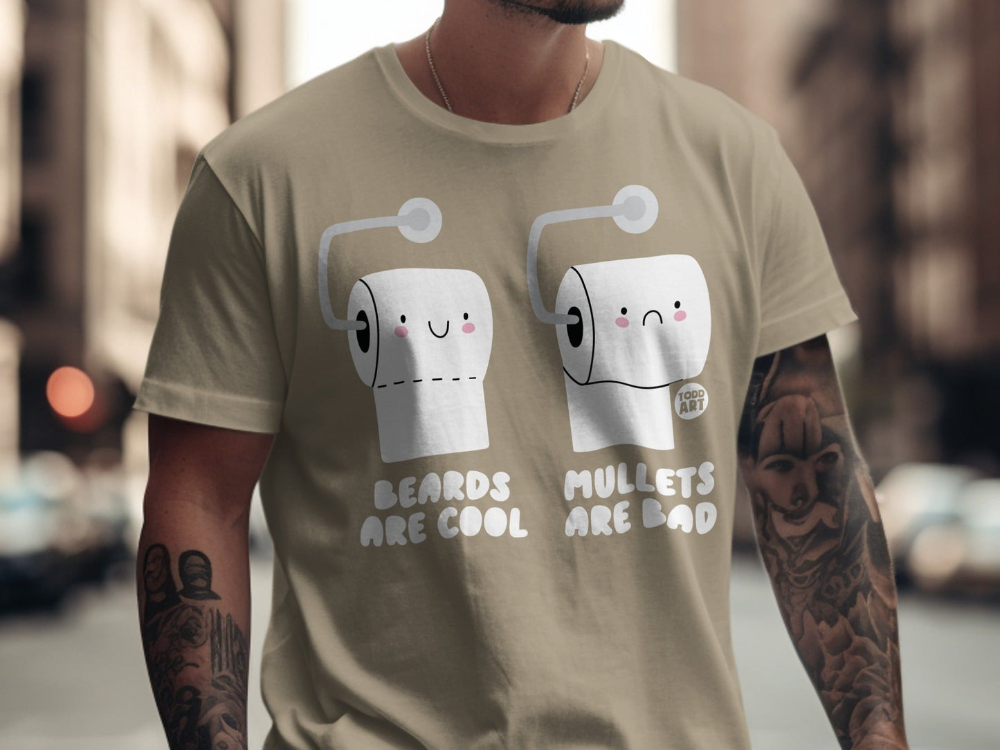 Two toilet paper rolls with faces, one happy, one sad, on a tan t-shirt.