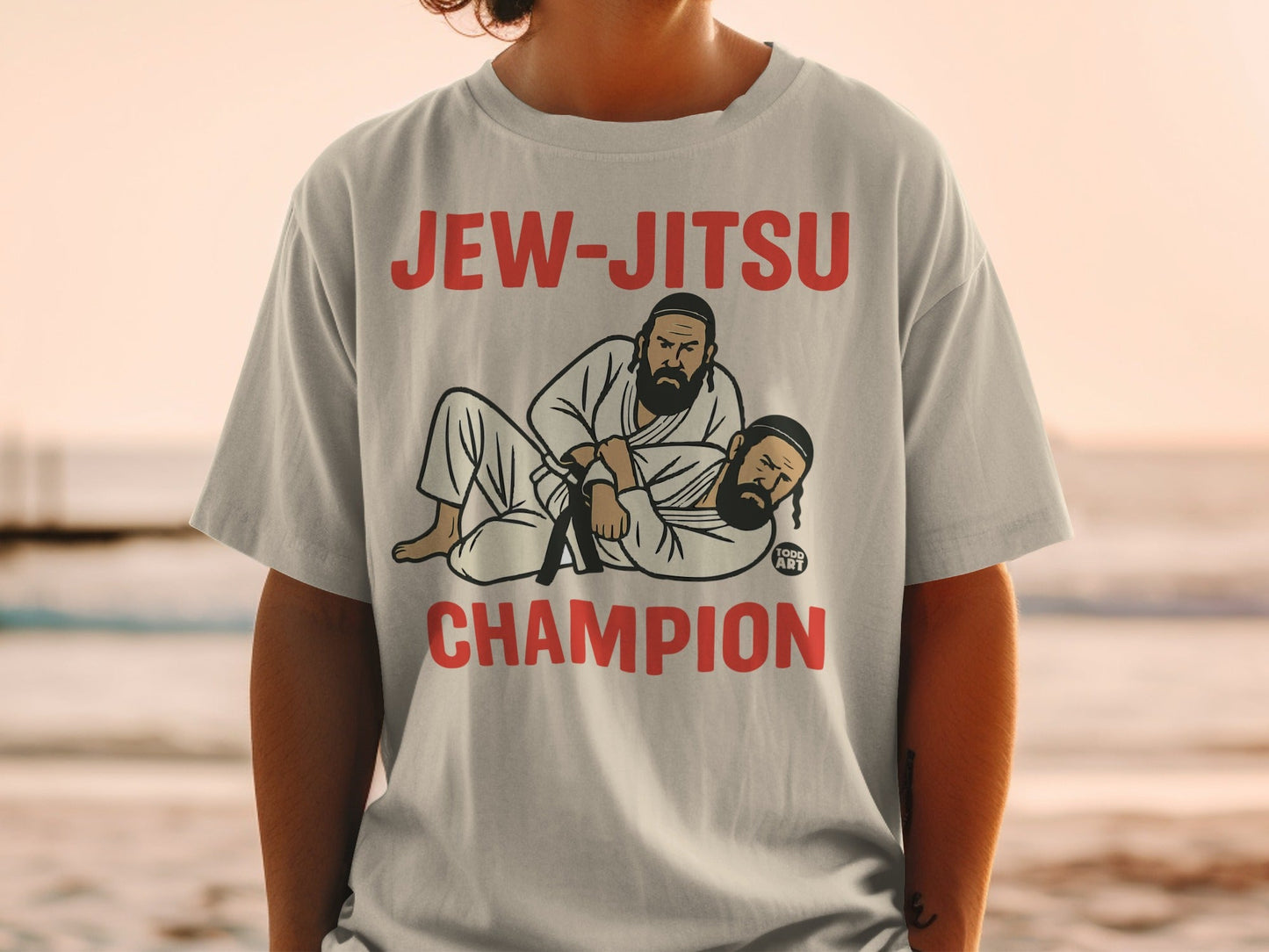 Grey t-shirt with "Jew-Jitsu Champion" and graphic of two men grappling.