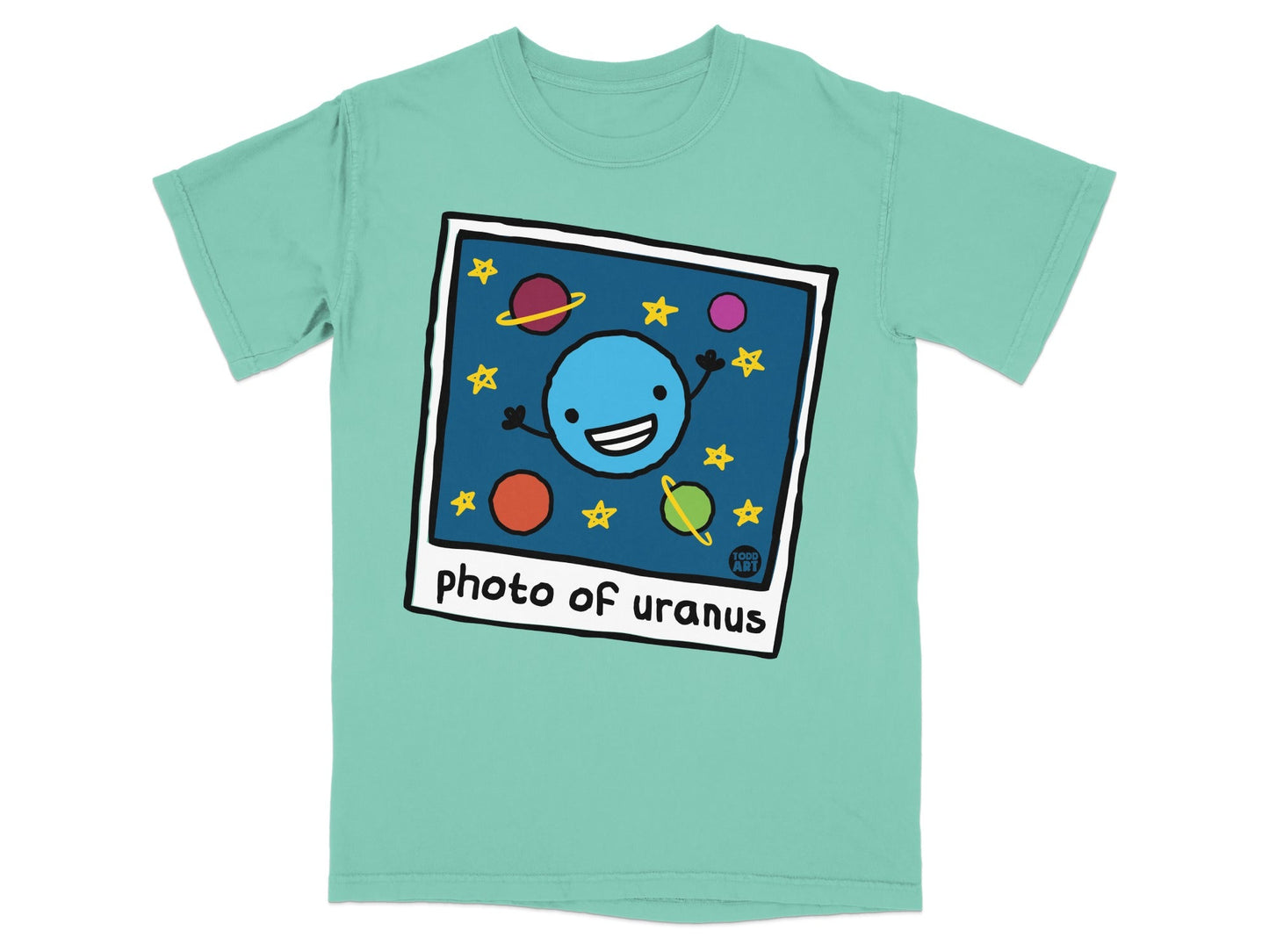 Shirt with cartoon planet smiling, surrounded by stars and planets.