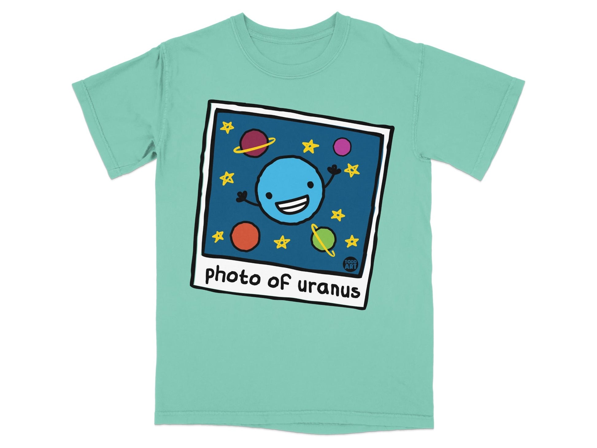 Shirt with cartoon planet smiling, surrounded by stars and planets.