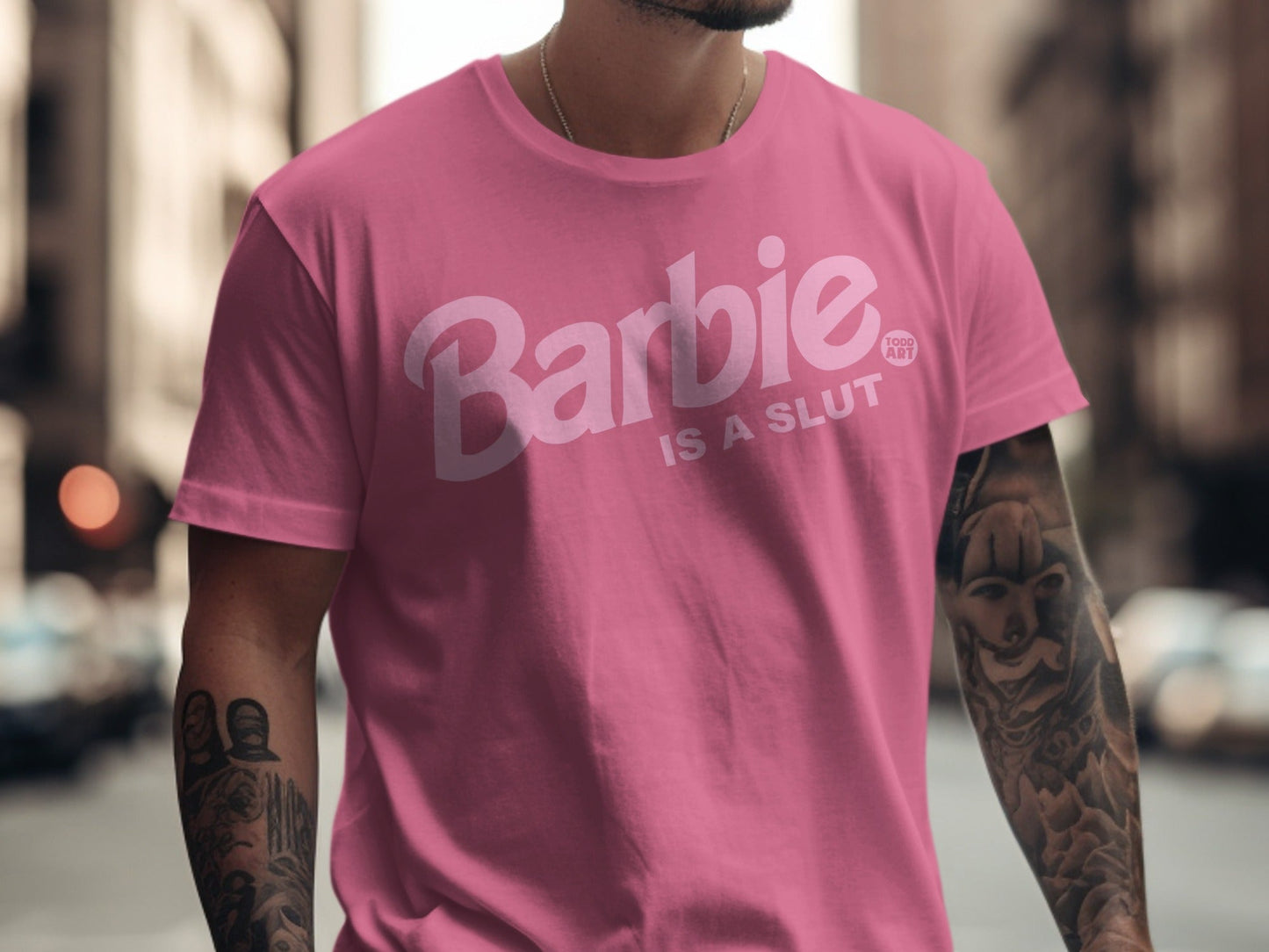Pink t-shirt with "Barbie IS A SLUT" text and Barbie logo.