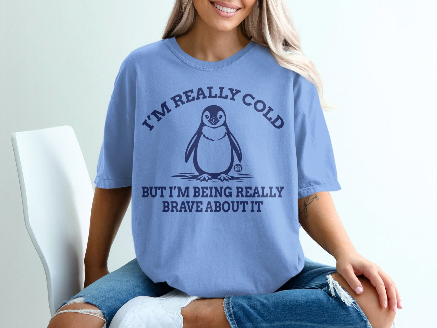 Periwinkle t-shirt with penguin and "I'm really cold but I'm being really brave about it."