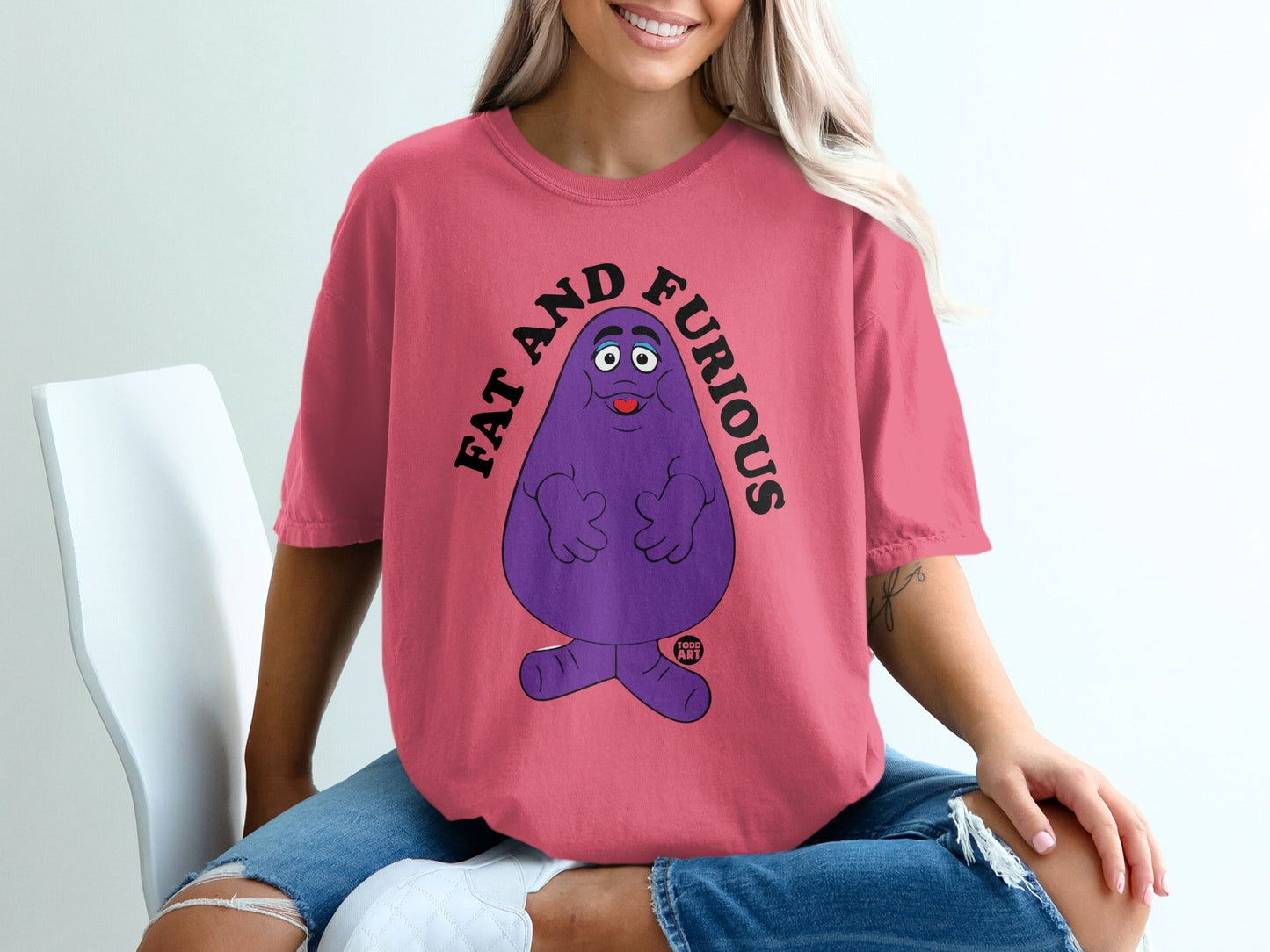Pink t-shirt with Grimace character and "FAT AND FURIOUS" text.