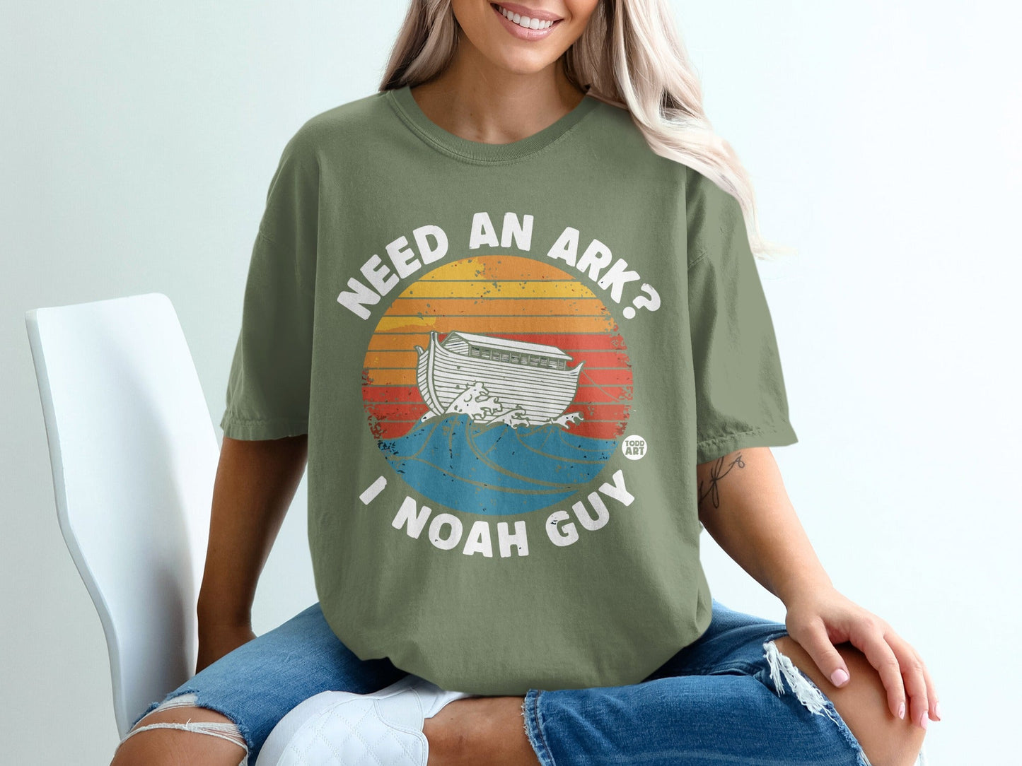Olive t-shirt with "NEED AN ARK? I NOAH GUY" and Noah's Ark graphic.