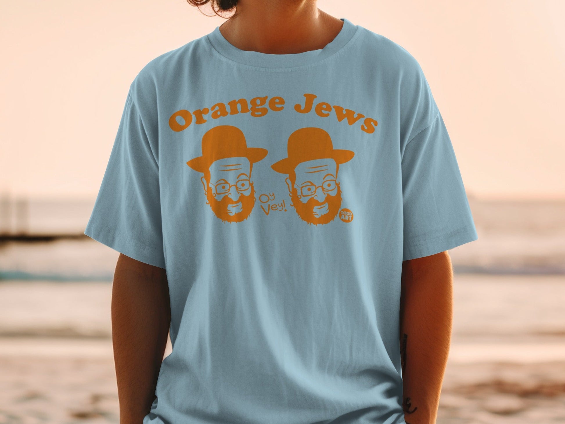 Light blue t-shirt with "Orange Jews Oy Vey!" and cartoon faces.