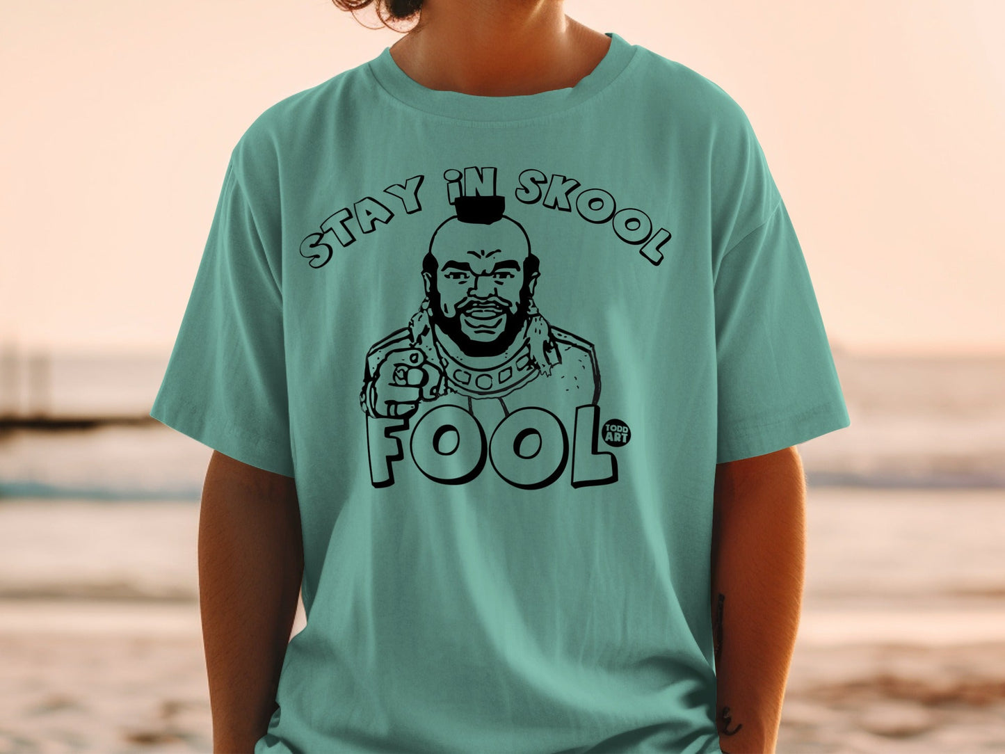 T-shirt with Mr. T graphic and "STAY IN SKOOL FOOL" text.
