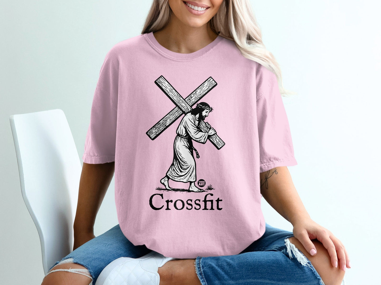 Pink t-shirt featuring Jesus carrying a cross with "Crossfit" text below.