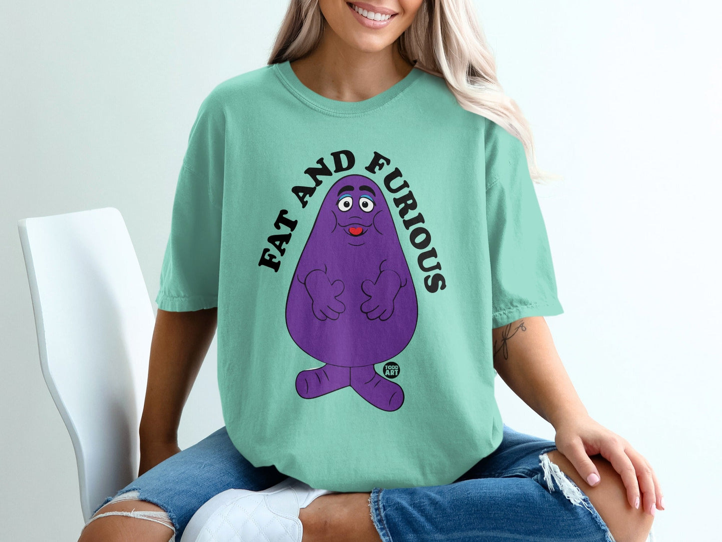 Teal t-shirt with Grimace character and "FAT AND FURIOUS" text.