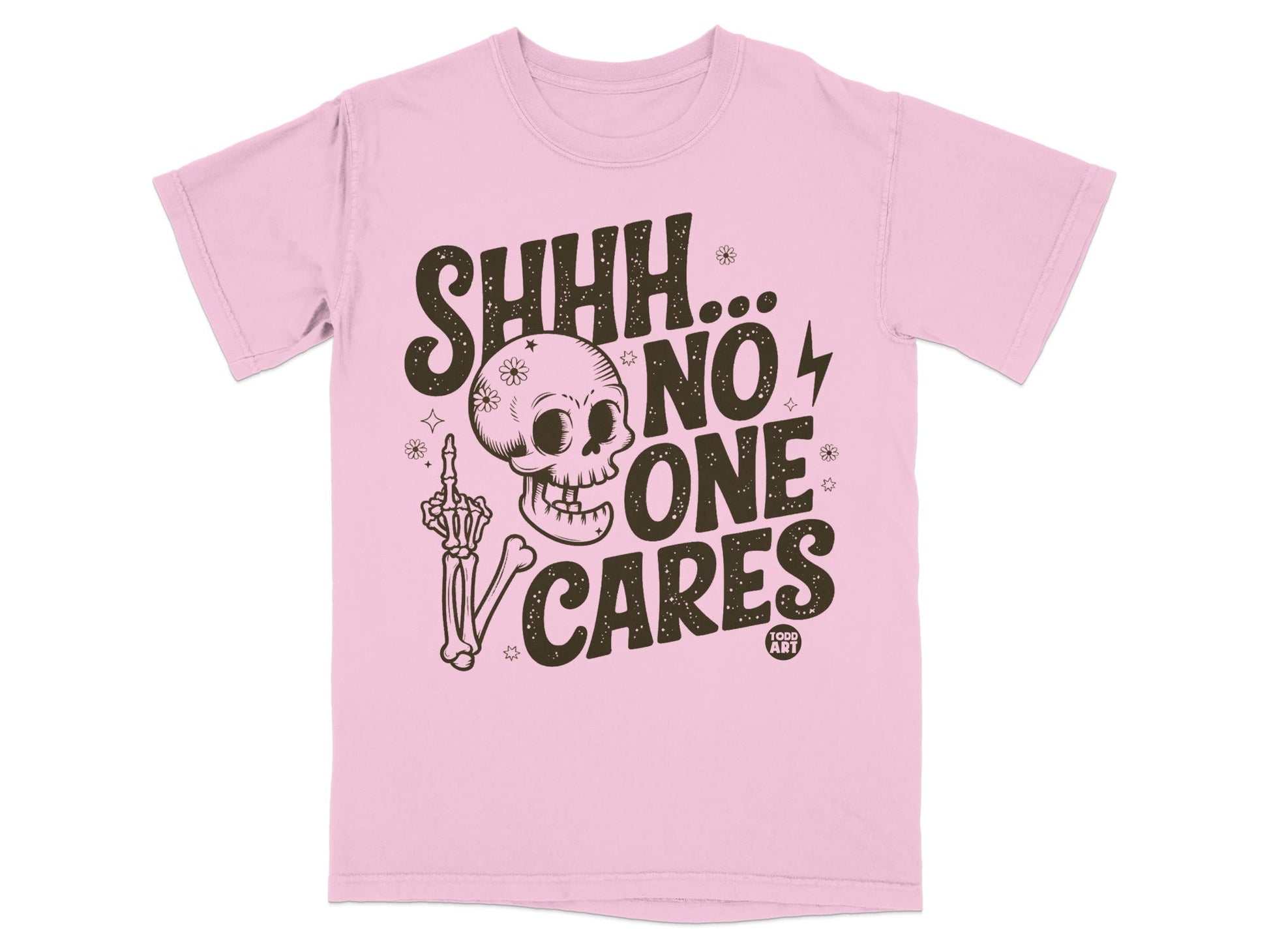 Pink t-shirt with skeleton hand and skull graphic saying "SHHH... NO ONE CARES".