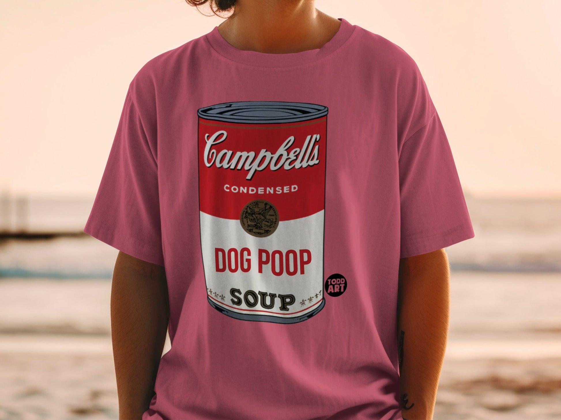 Pink t-shirt with Campbell's Soup can design, "Dog Poop Soup" text.