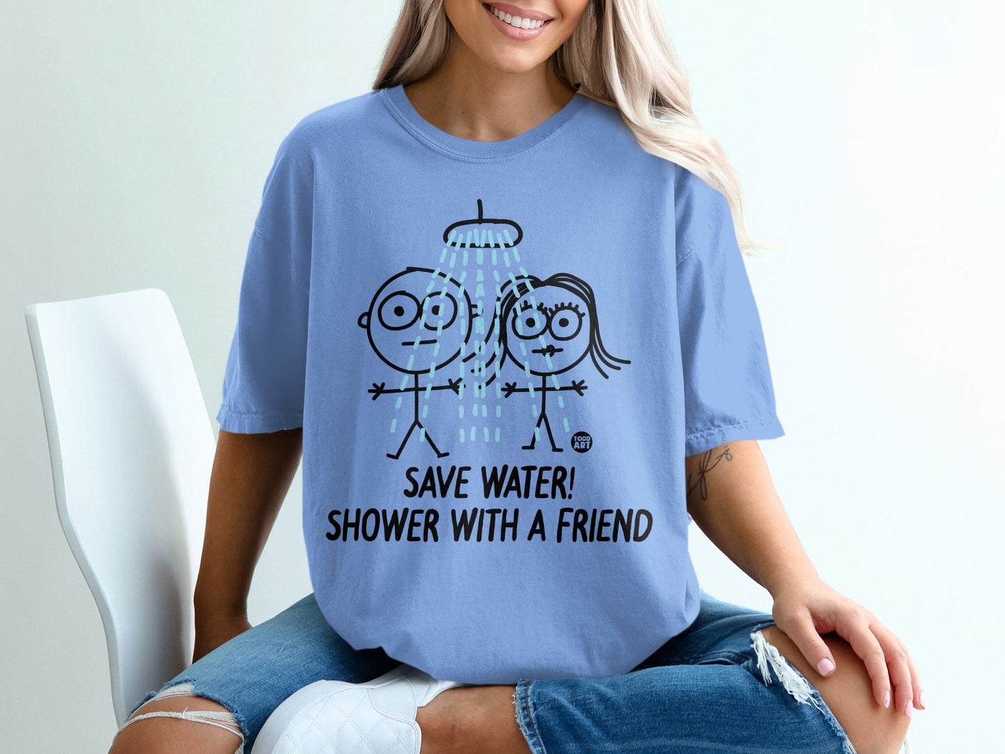 Blue t-shirt with stick figures showering and text "SAVE WATER! SHOWER WITH A FRIEND!".