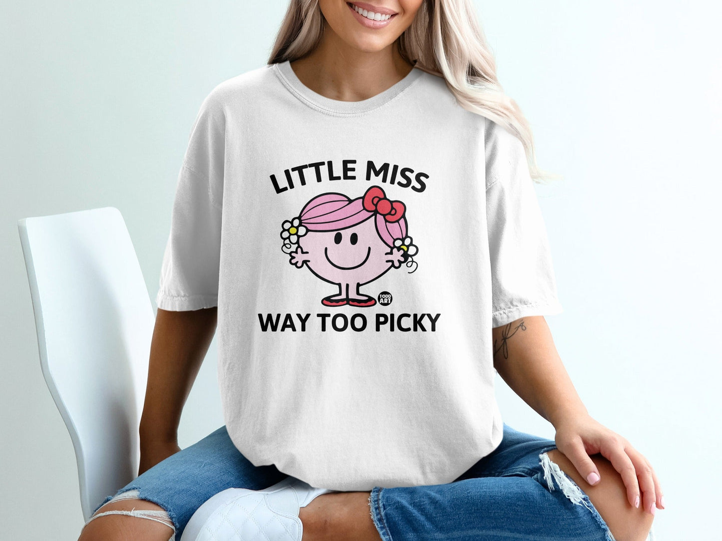 White t-shirt with "Little Miss Too Picky" text and character.