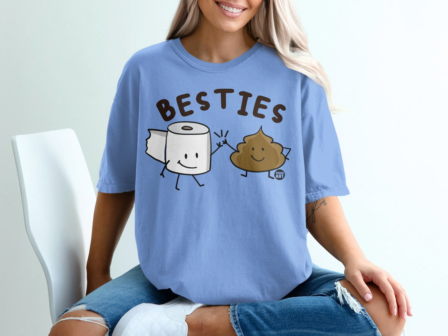 Blue t-shirt with "BESTIES" text and cartoon toilet paper and poop characters.