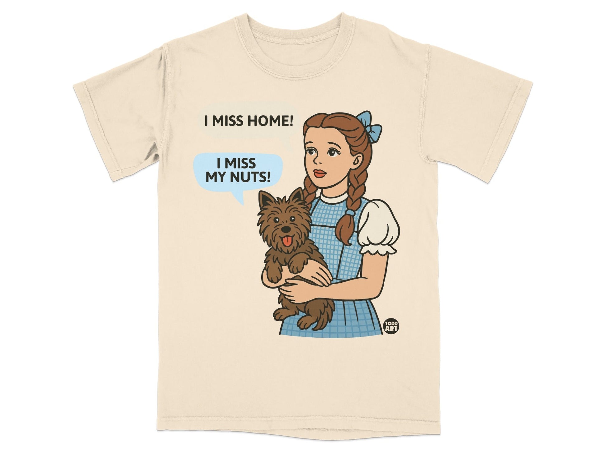 Dorothy holding Toto, saying "I miss my nuts!" on a t-shirt.