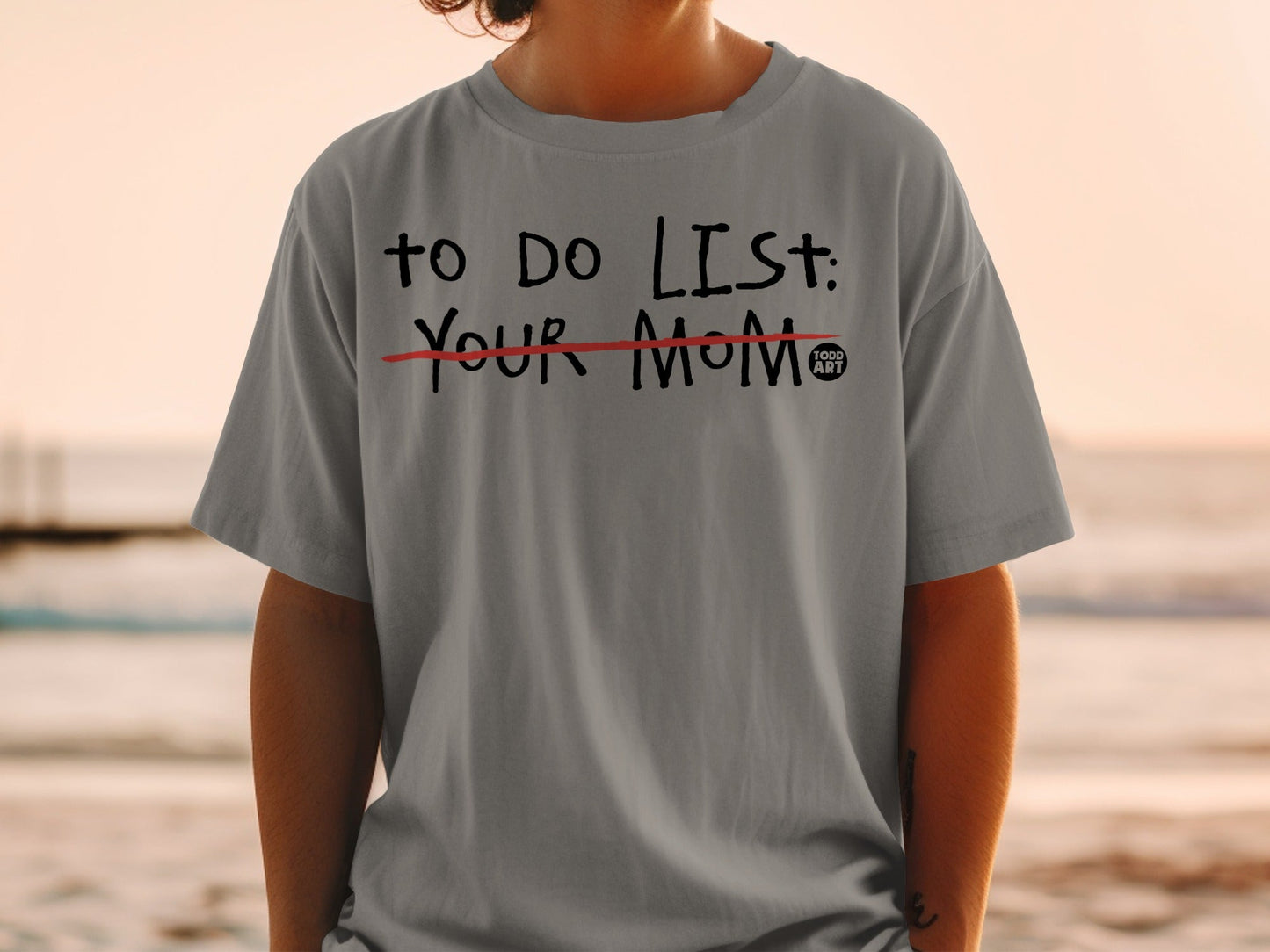 Gray t-shirt with "TO DO LIST: YOUR MOM" printed in black and red.