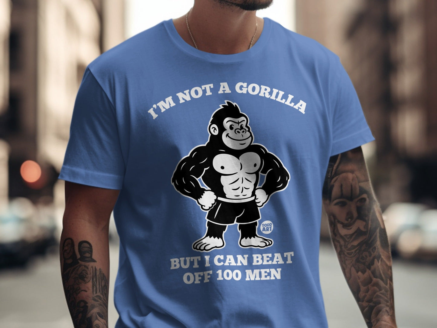 Blue t-shirt with gorilla graphic and text "I'M NOT A GORILLA BUT I CAN BEAT OFF 100 MEN".