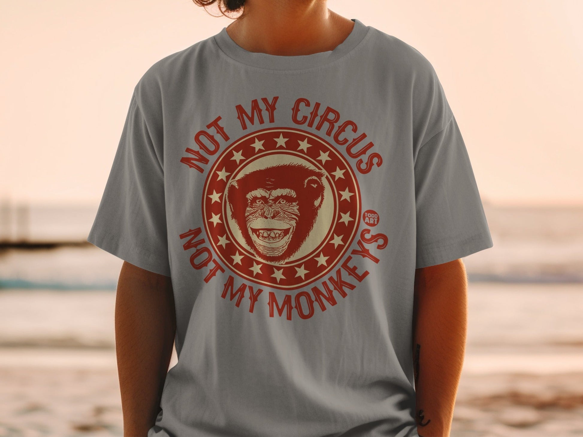 T-shirt with "Not My Circus, Not My Monkeys" slogan and grinning monkey graphic.