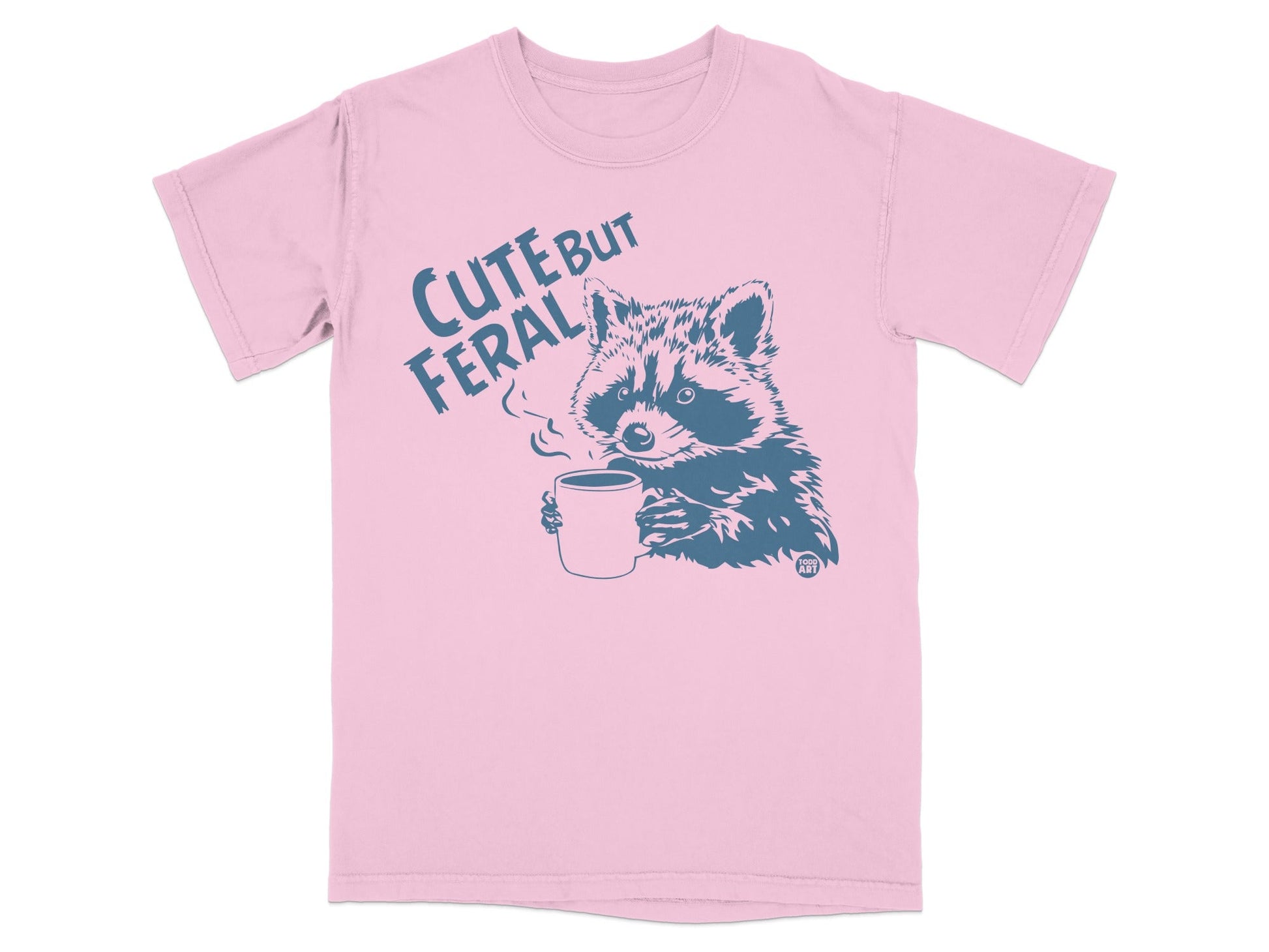T-shirt with raccoon holding coffee cup and text "Cute But Feral".
