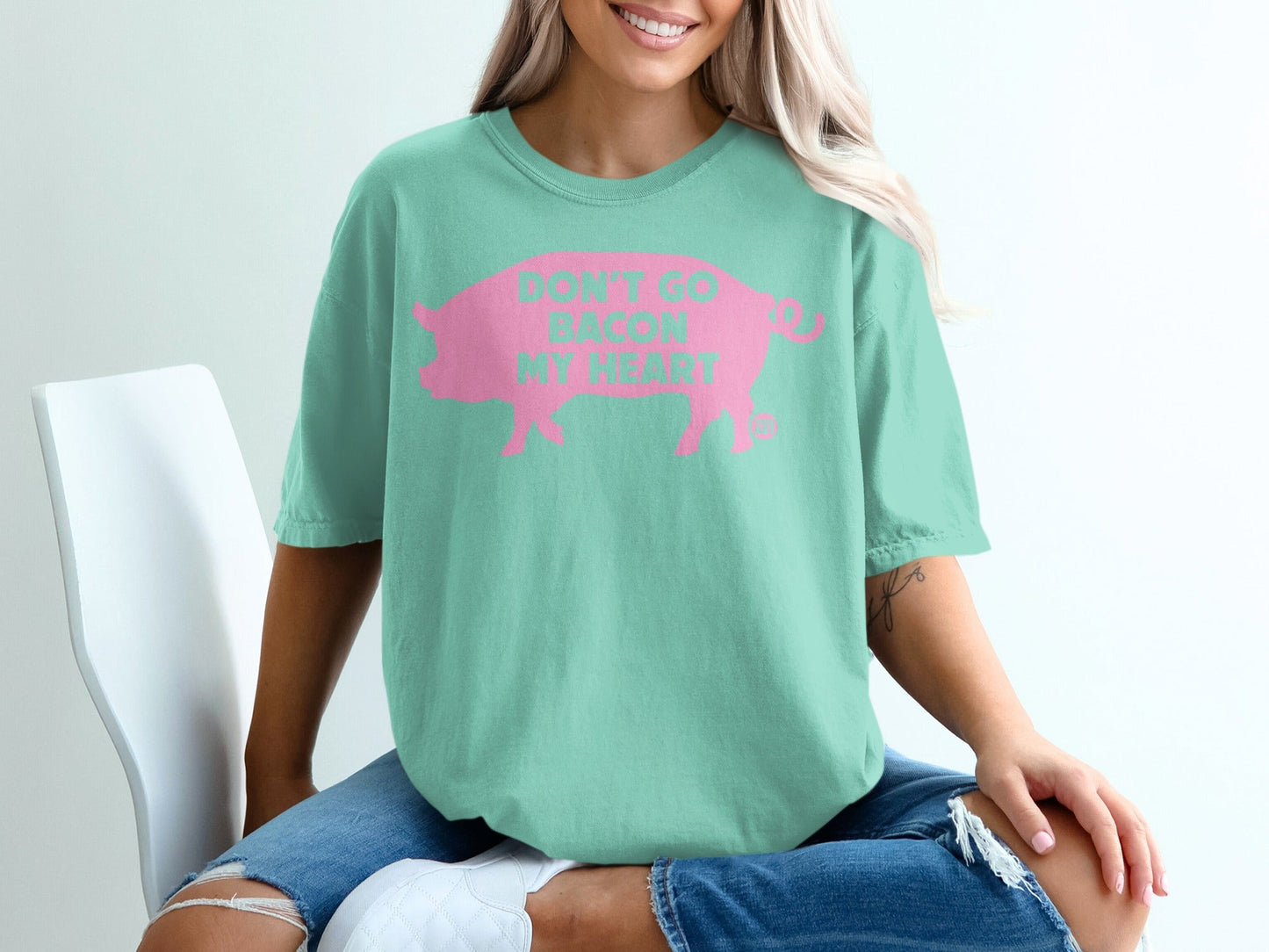 Mint green t-shirt with "Don't go bacon my heart" in pink font.