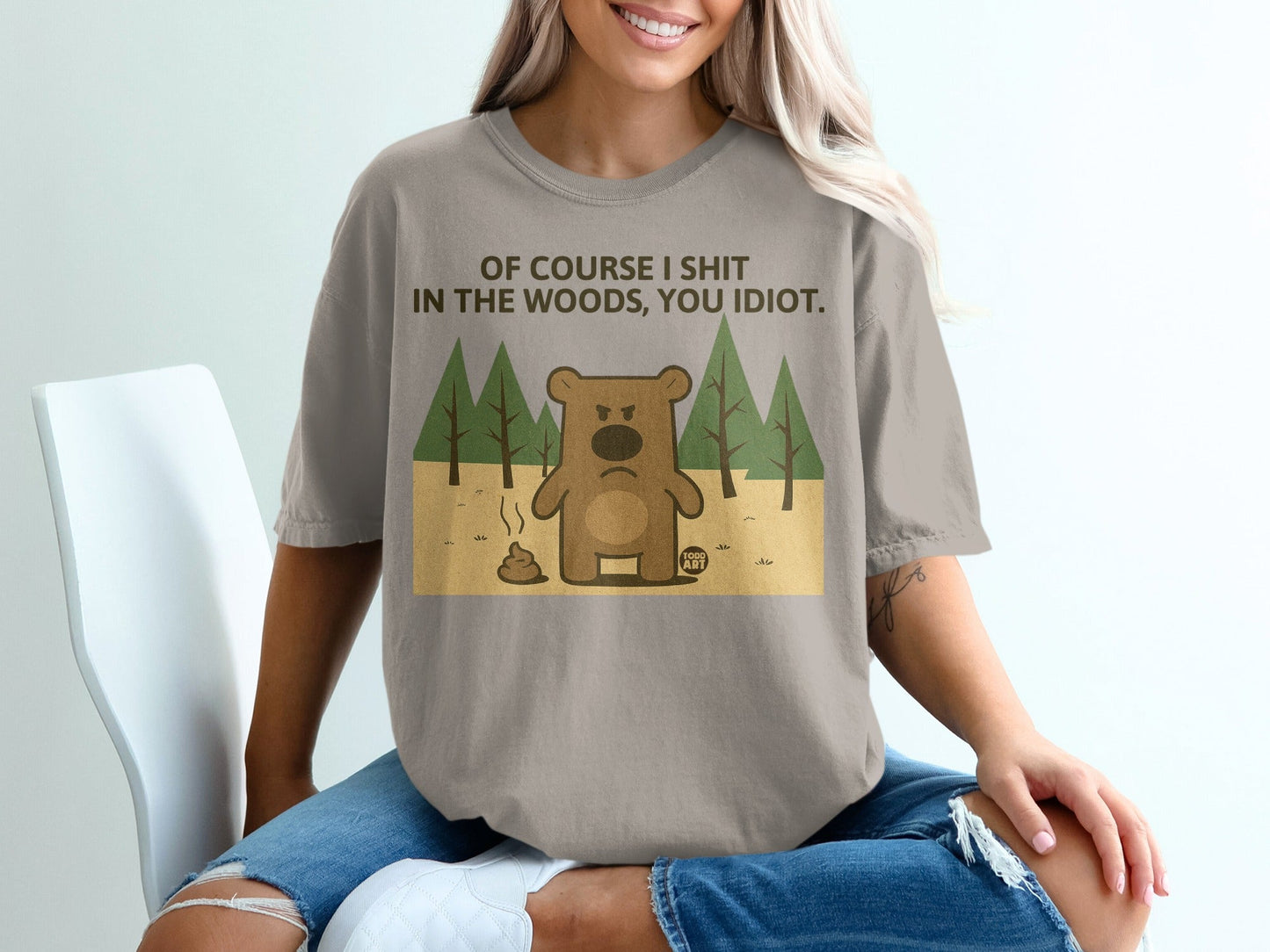T-shirt with a bear, trees, and text "Of course I shit in the woods, you idiot."