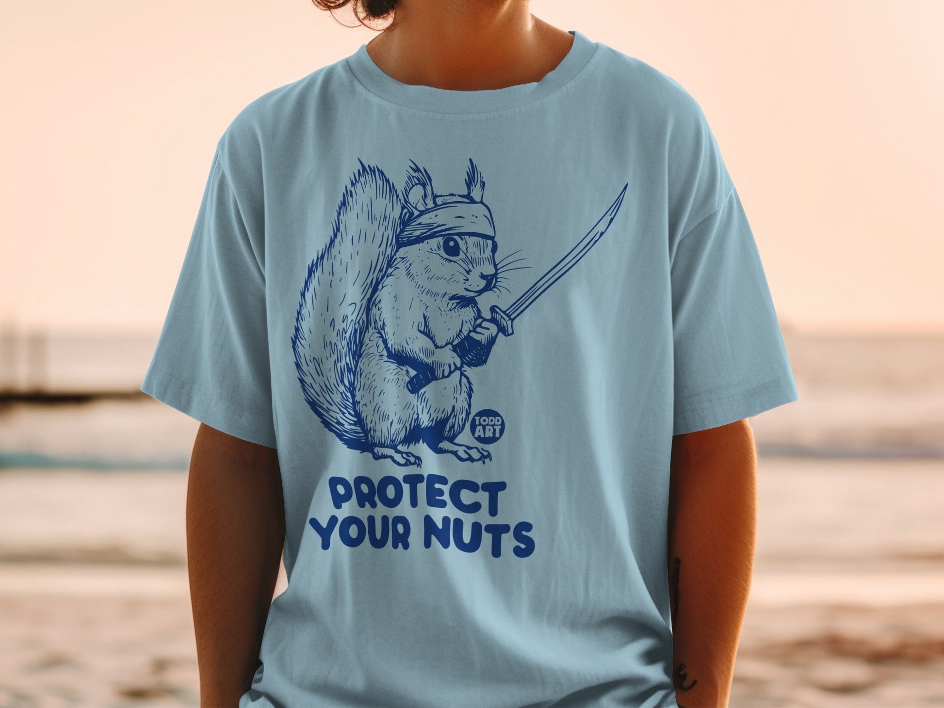Squirrel with sword and bandana, text "Protect Your Nuts" and "TODD ART".