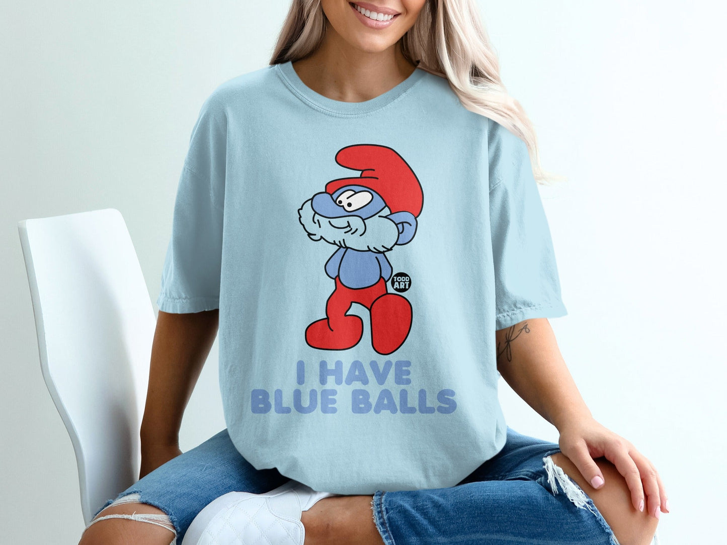 Light blue t-shirt with a Smurf character and the text "I HAVE BLUE BALLS".