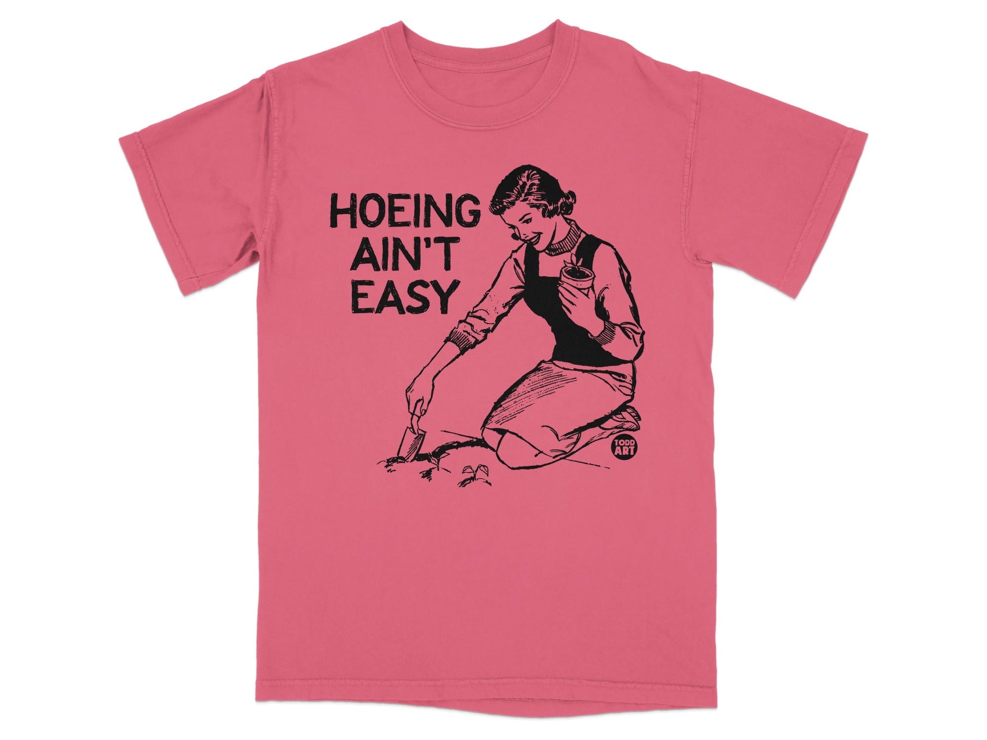 Woman gardening on shirt that reads "Hoeing Ain't Easy".