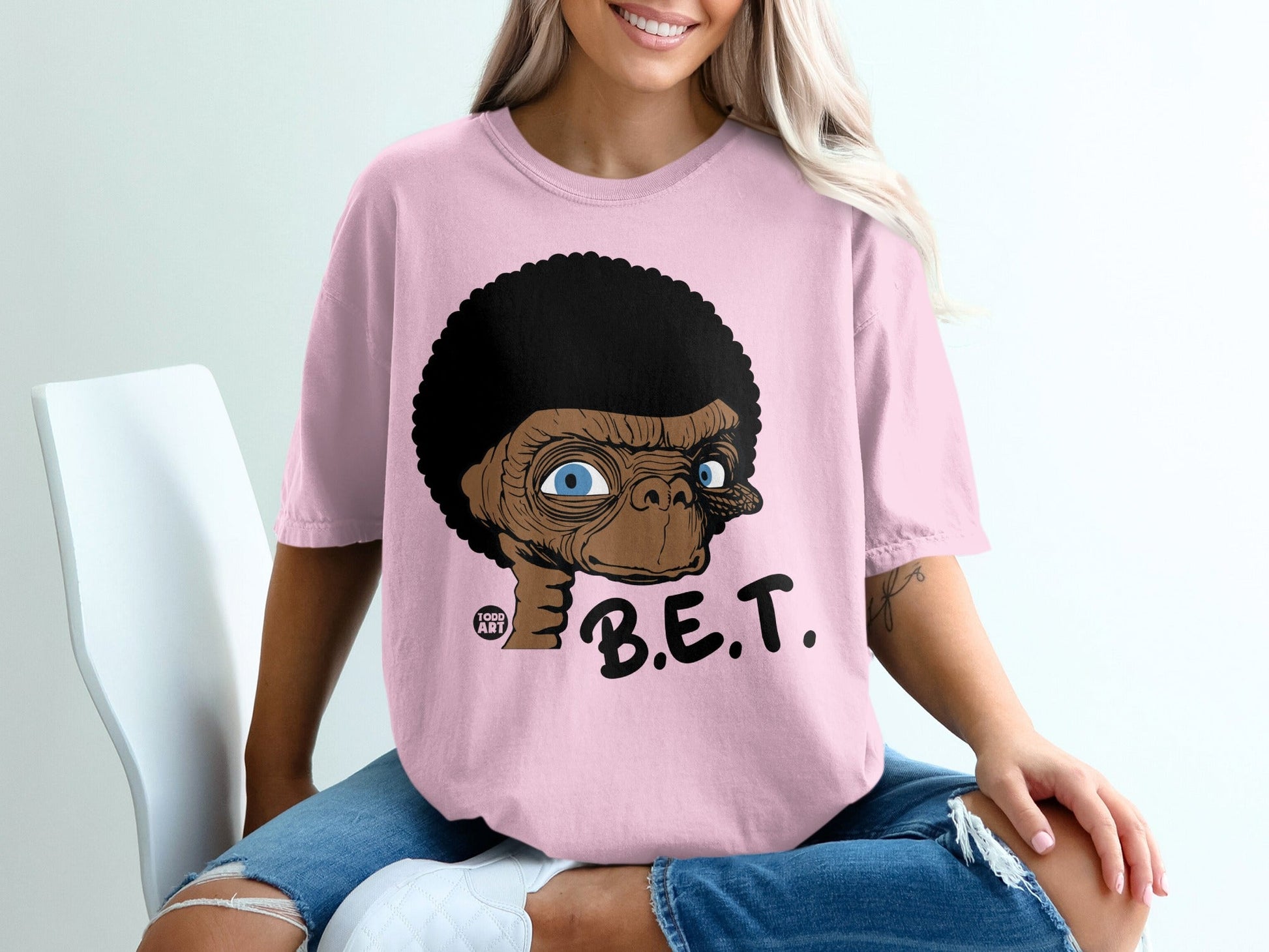 Pink t-shirt with cartoon E.T. and "B.E.T." text.