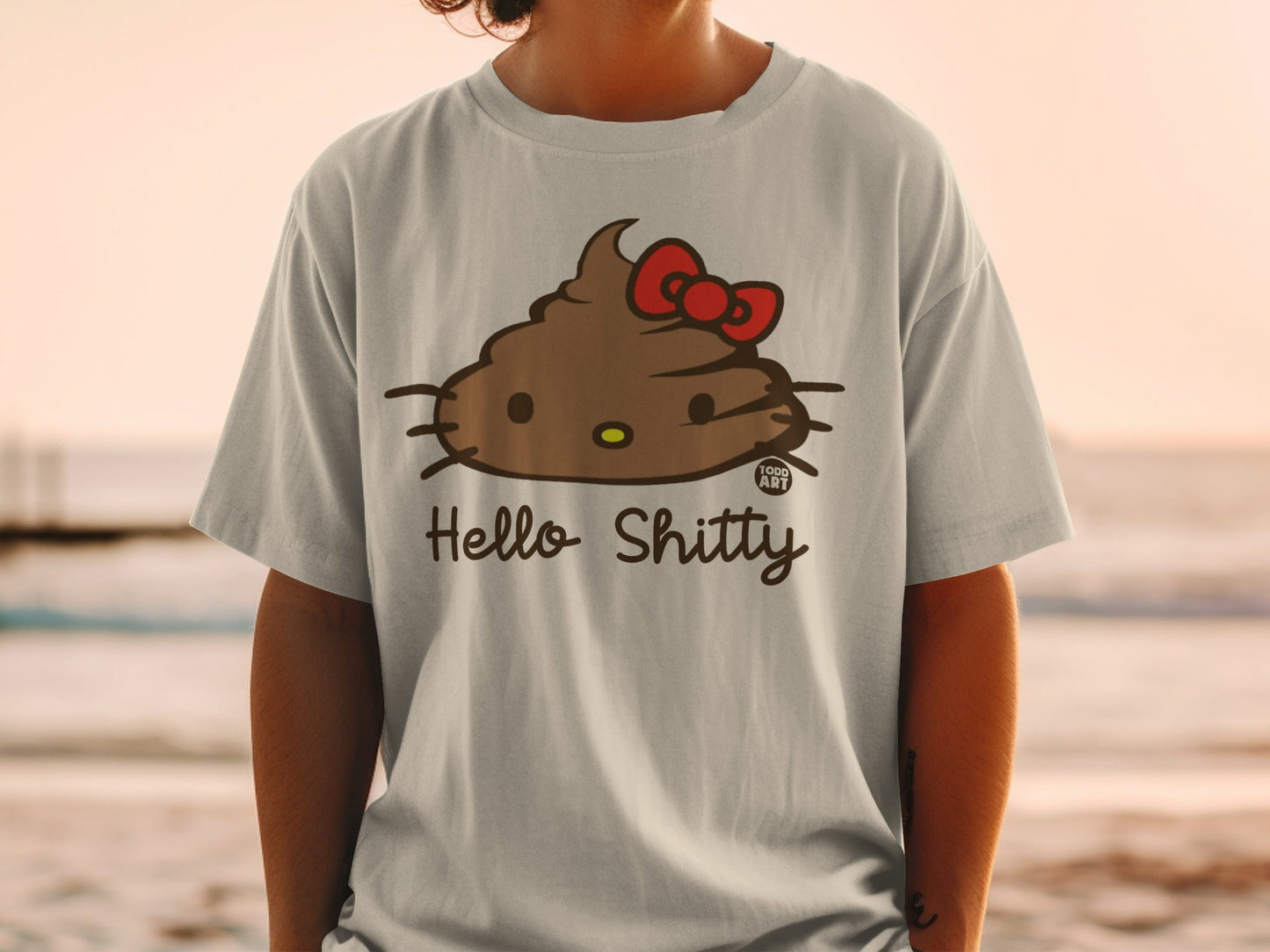 Light grey t-shirt with a brown poop emoji design and "Hello Shitty" text.