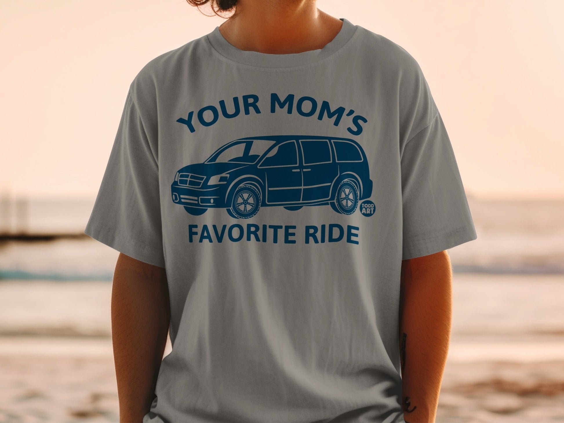 Gray t-shirt with "YOUR MOM'S FAVORITE RIDE" and minivan graphic in blue.
