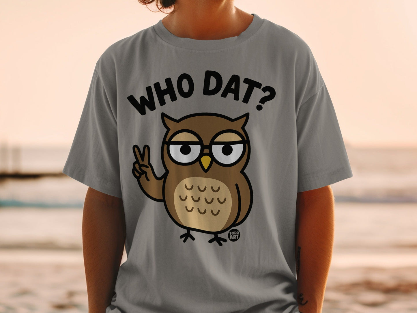 Grey t-shirt with cartoon owl giving peace sign and text "WHO DAT?"