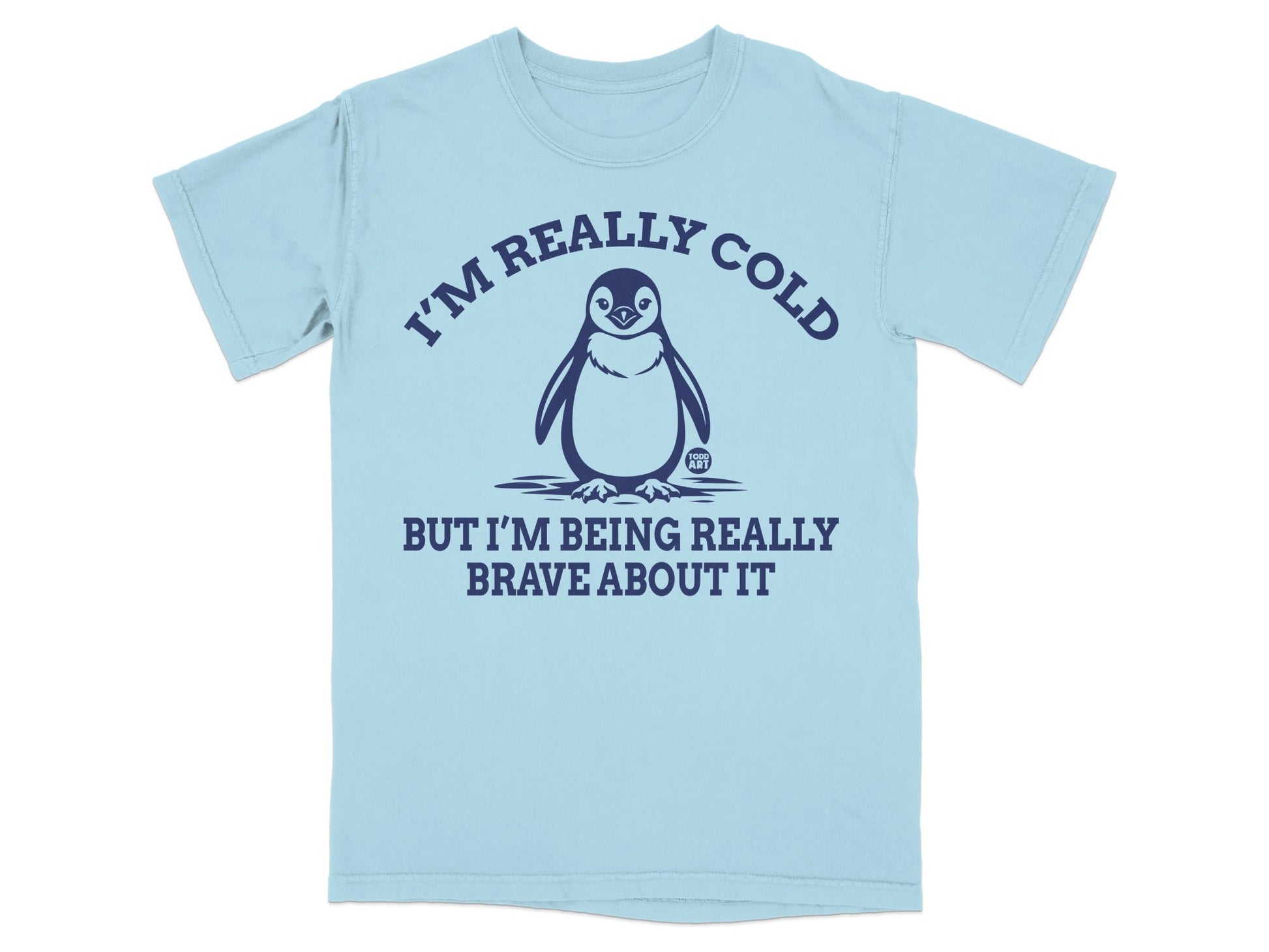 Light blue t-shirt with a penguin and text "I'M REALLY COLD BUT I'M BEING REALLY BRAVE ABOUT IT".