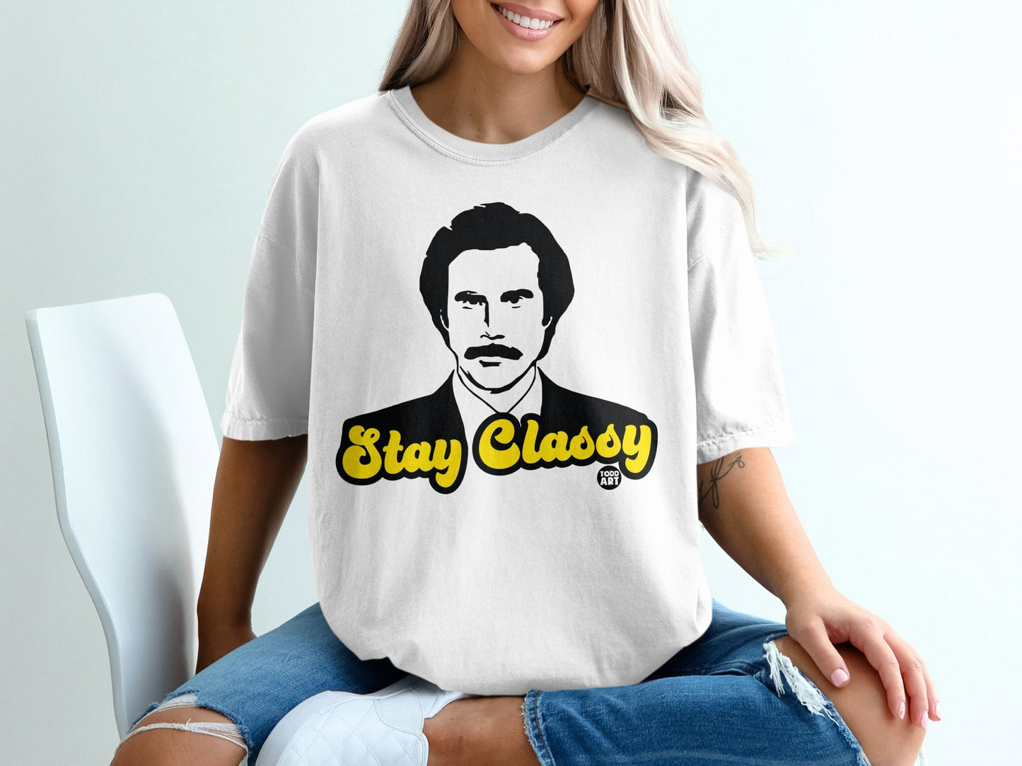 White t-shirt with Ron Burgundy's face and "Stay Classy" text.