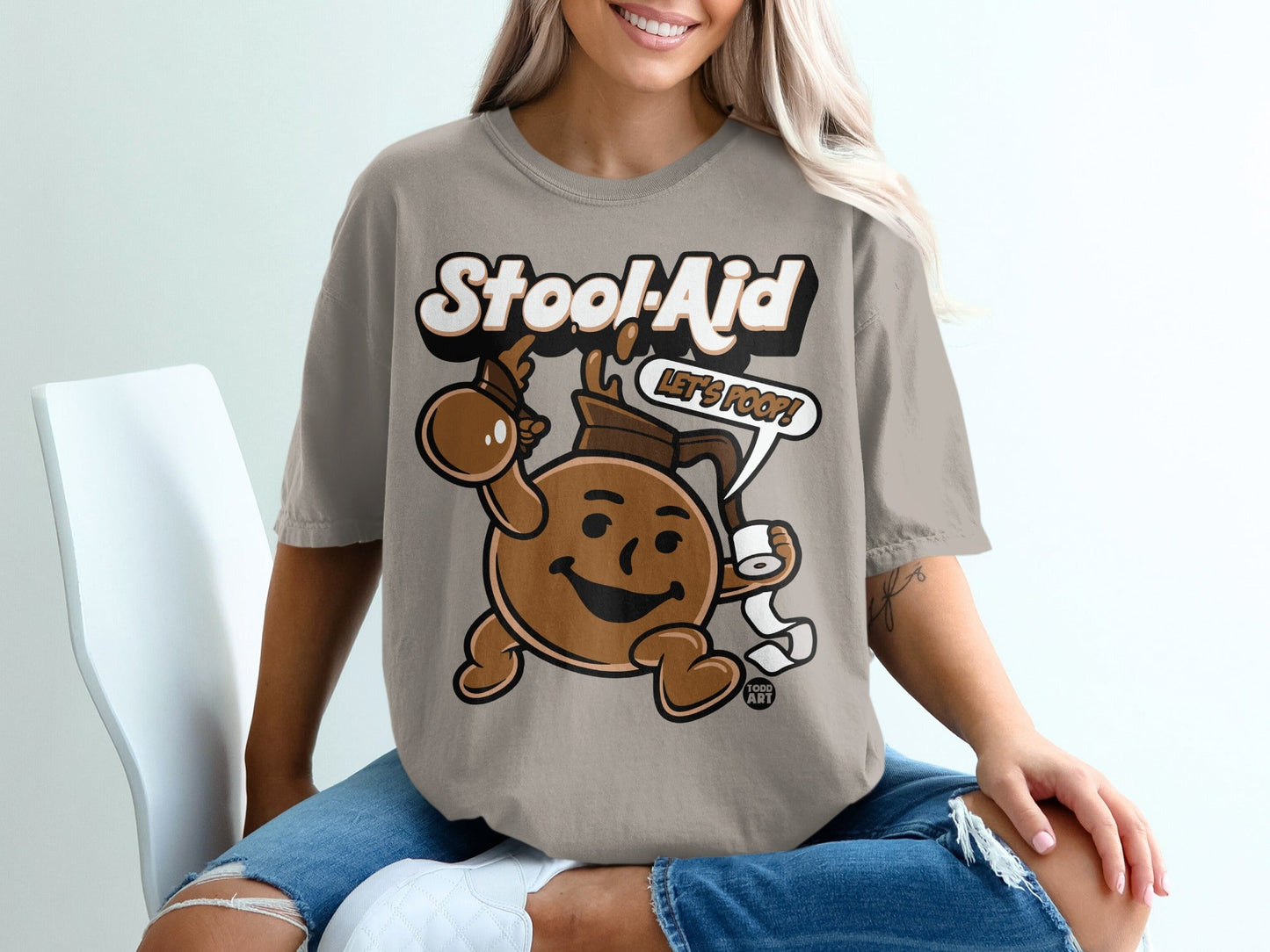 Brown character in t-shirt holding toilet paper, with "Stool-Aid Let's Poop!" text.