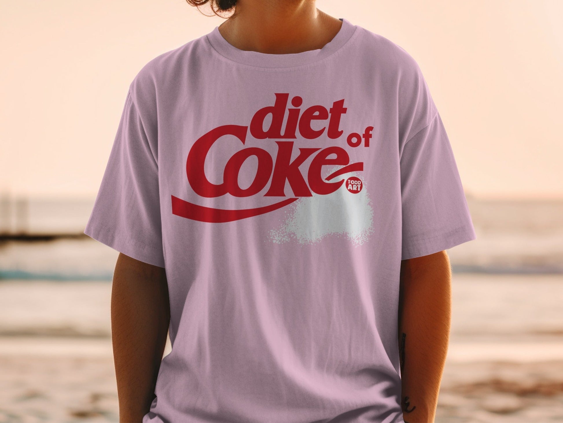 Pink t-shirt with "diet Coke" logo and white powder.