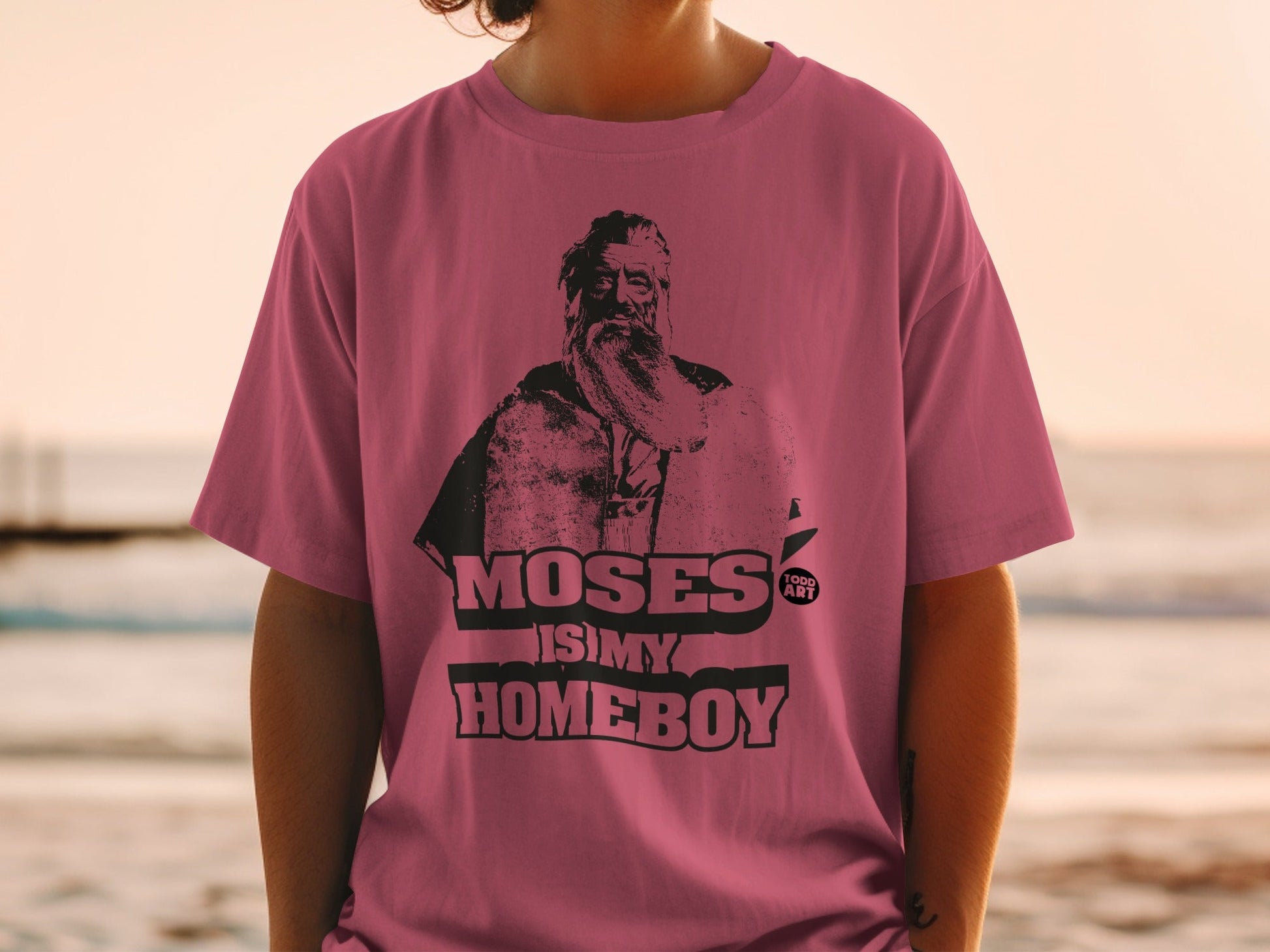 T-shirt with a portrait of Moses and text "MOSES IS MY HOMEBOY".