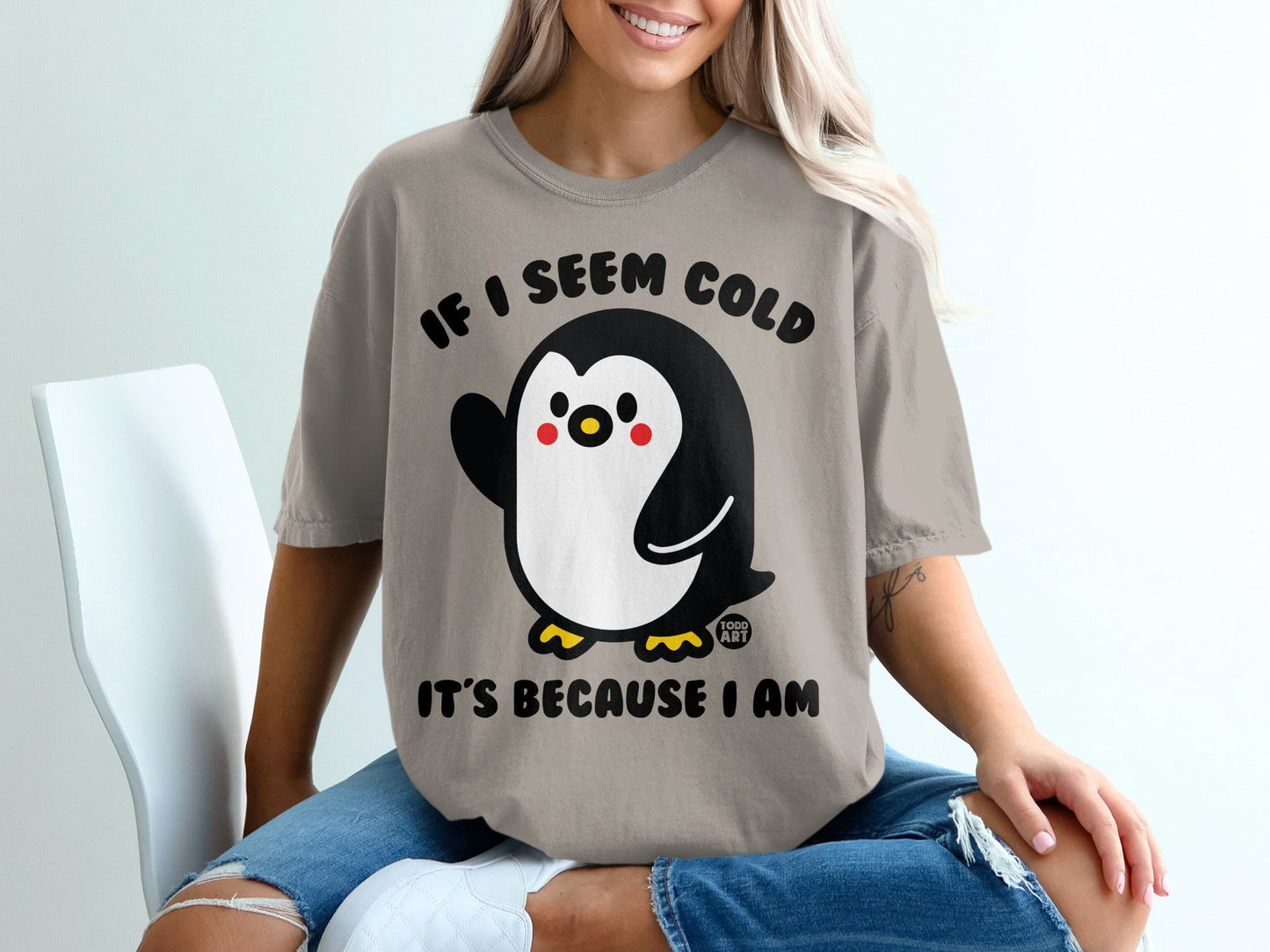 Penguin graphic t-shirt with "If I seem cold it's because I am" text.