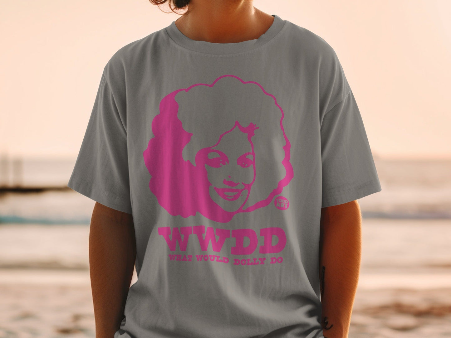 Grey t-shirt with pink "WWDD What Would Dolly Do" text and Dolly Parton graphic.