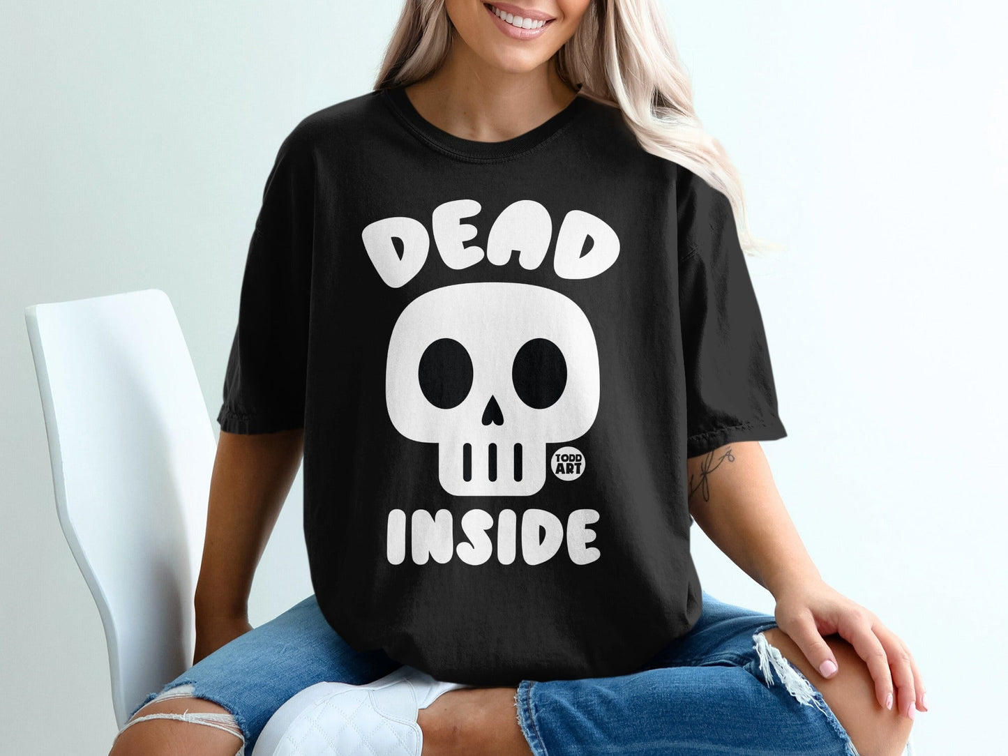 Black t-shirt with white skull graphic and "DEAD INSIDE" text.