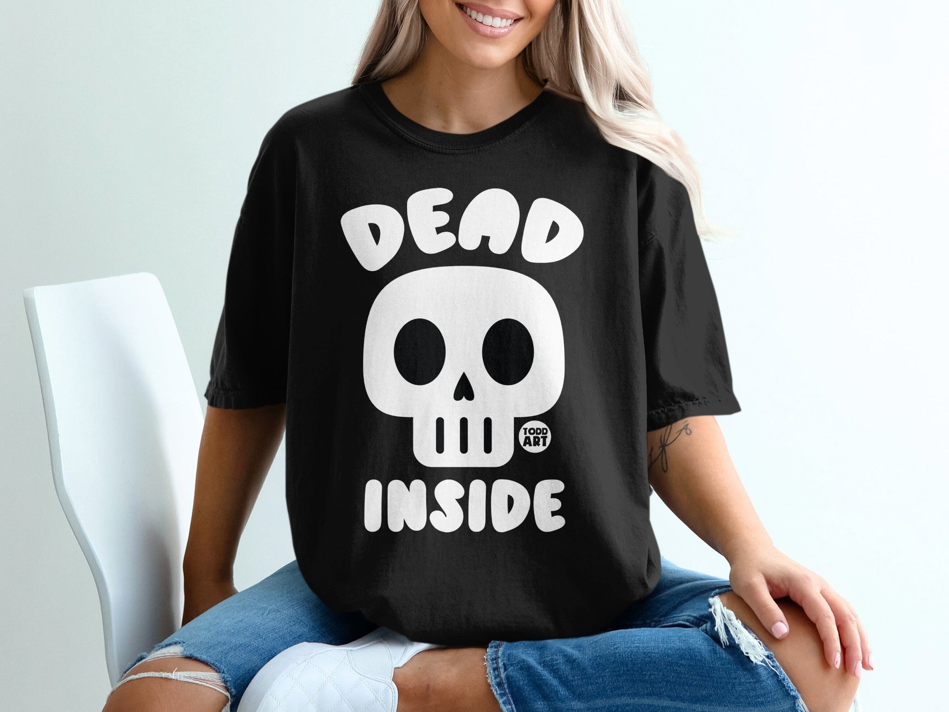 Black t-shirt with white skull graphic and "DEAD INSIDE" text.