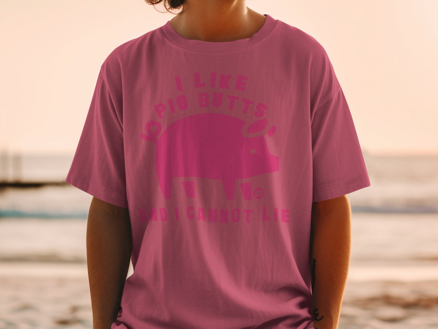 Pink t-shirt with pig and text "I like pig butts and I cannot lie".