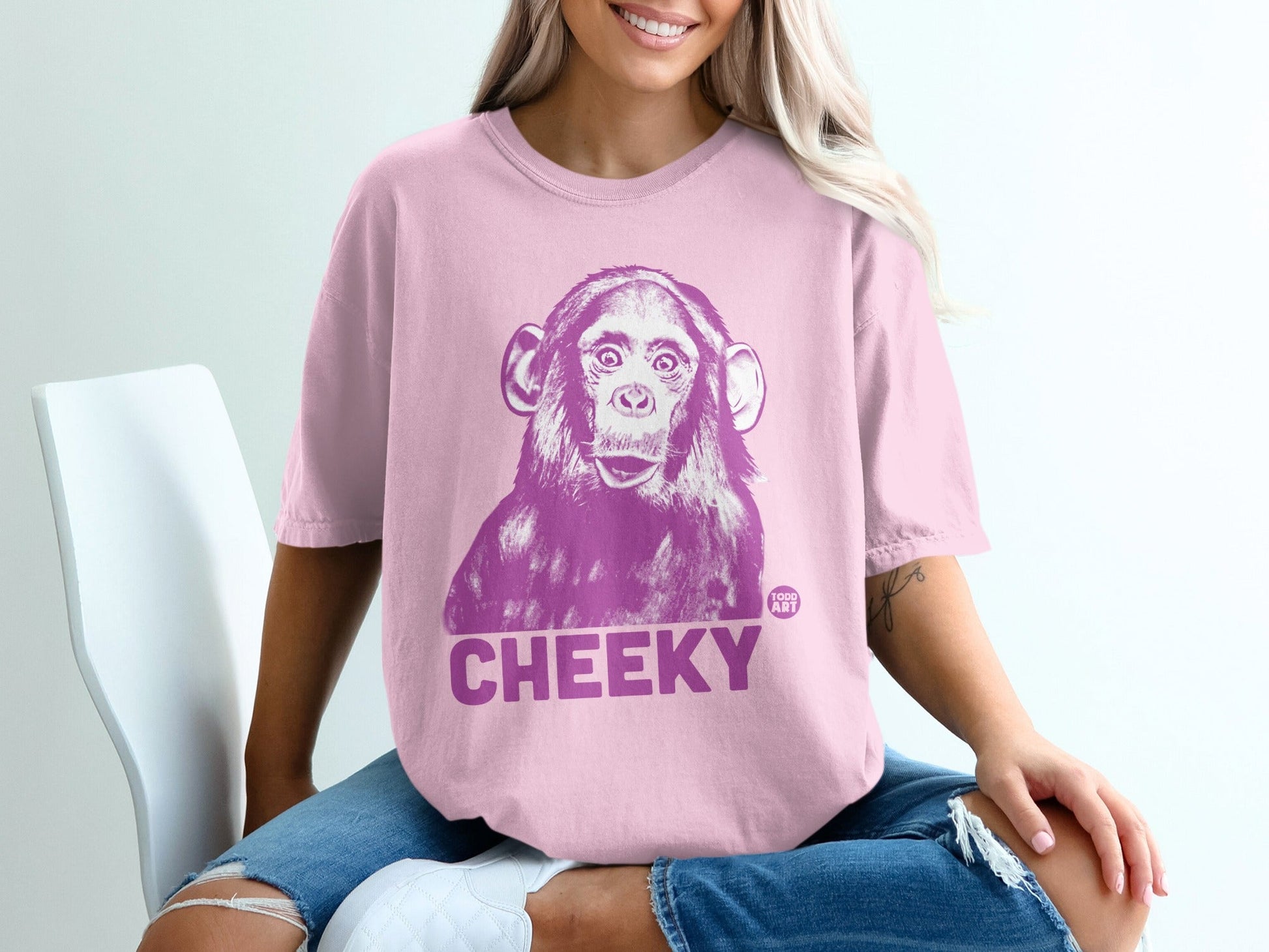 Pink t-shirt with a large purple chimpanzee graphic and "CHEEKY" text.