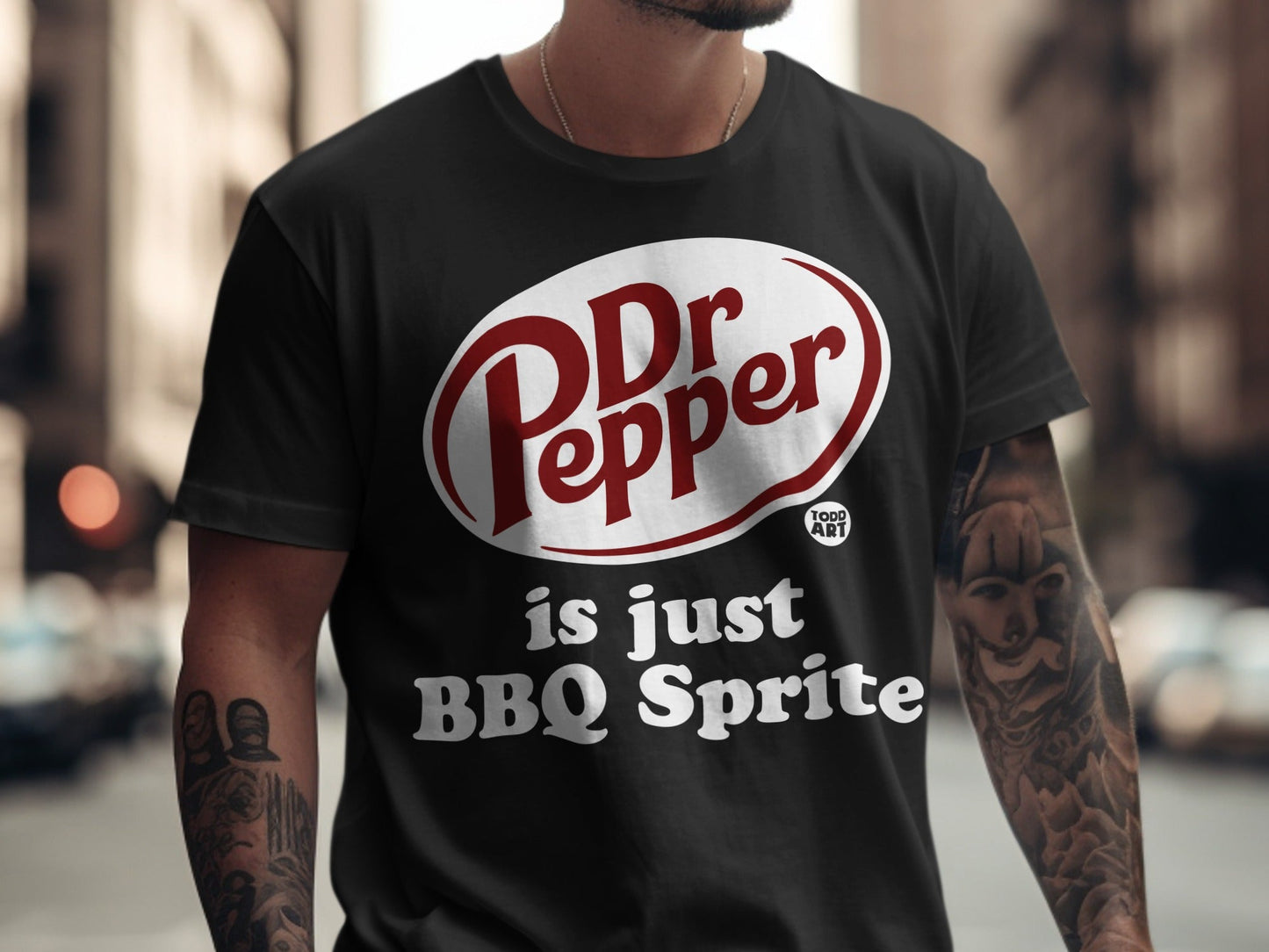 Black t-shirt with Dr Pepper logo and "is just BBQ Sprite" text.
