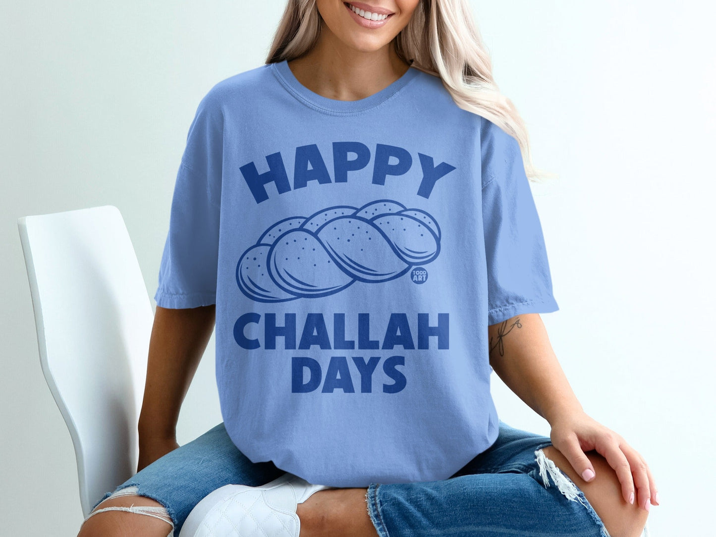 Blue t-shirt with "Happy Challah Days" and challah bread graphic.