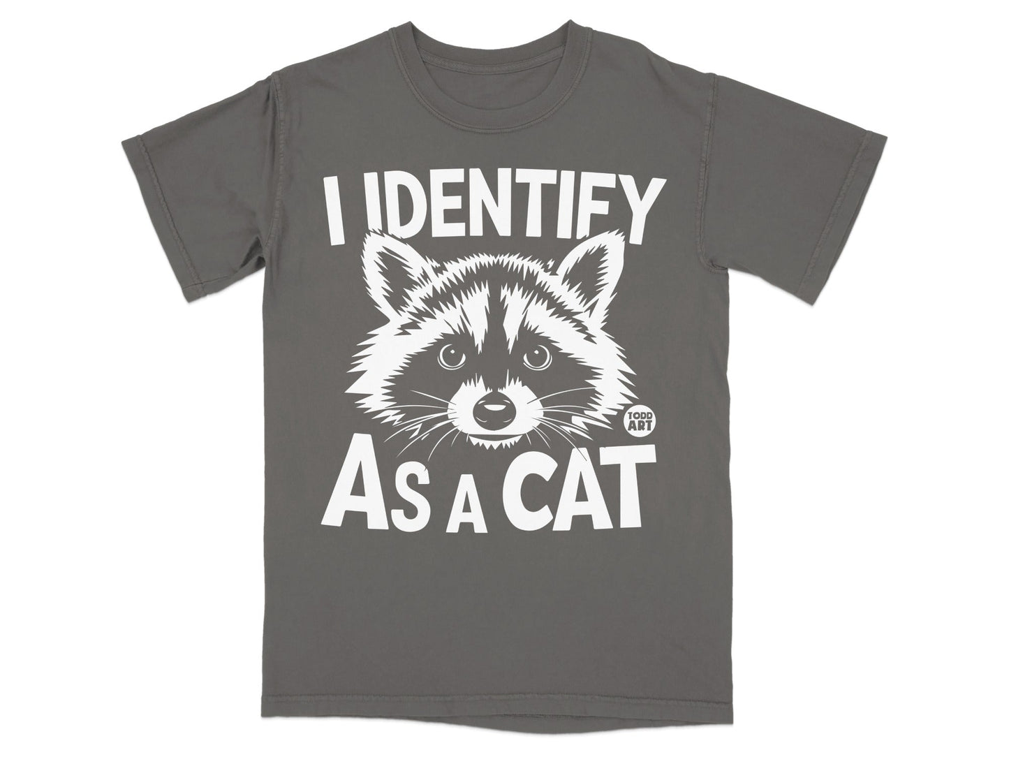 Dark grey t-shirt with white text and raccoon graphic that says "I IDENTIFY AS A CAT".