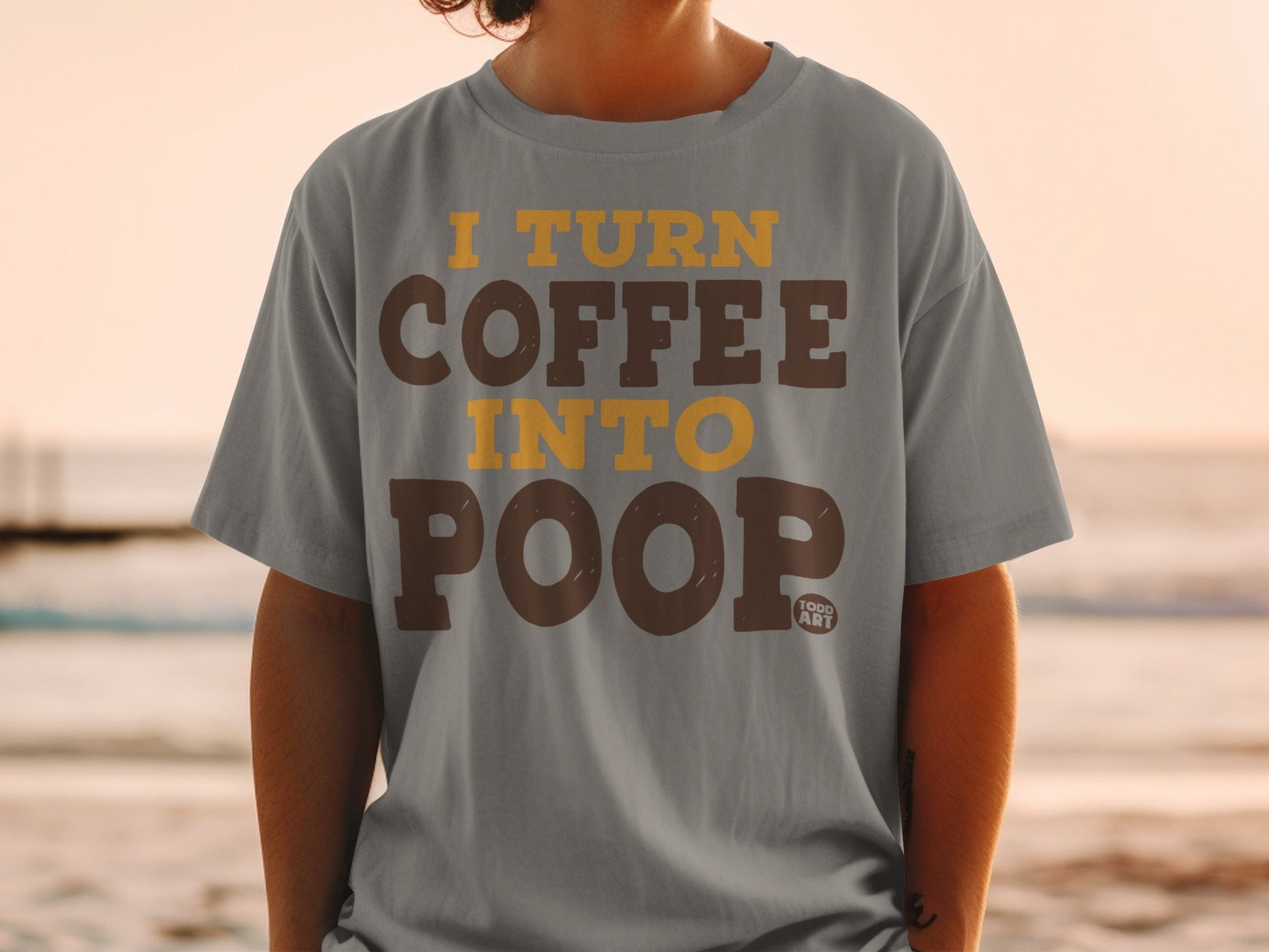 Gray t-shirt with "I turn coffee into poop" text.