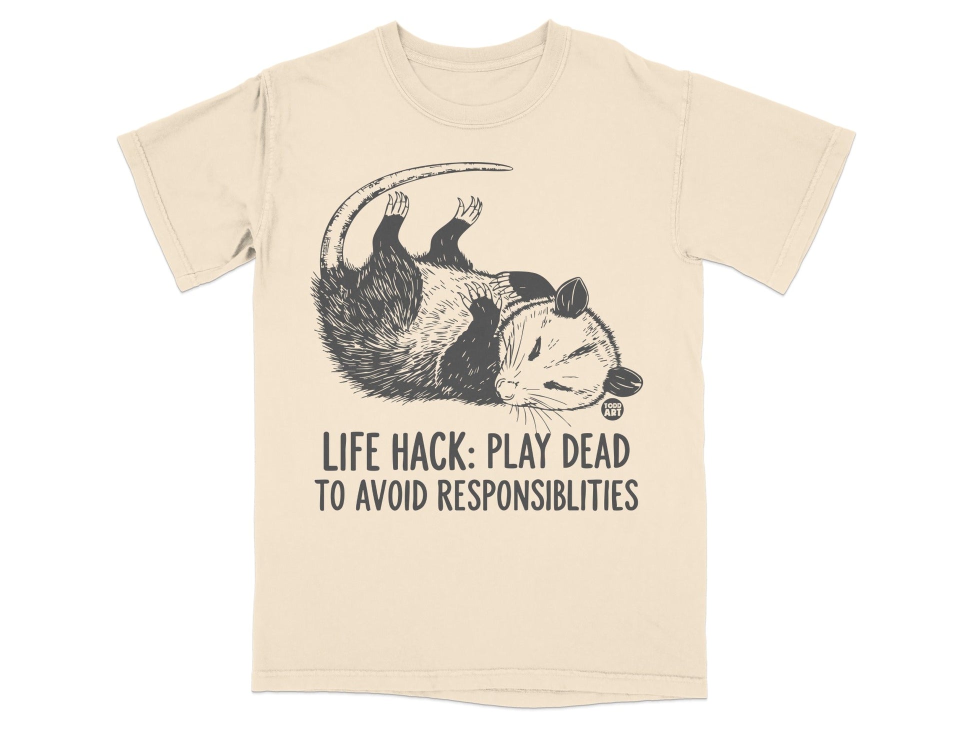 T-shirt with possum playing dead and text "LIFE HACK: PLAY DEAD TO AVOID RESPONSIBILITIES".