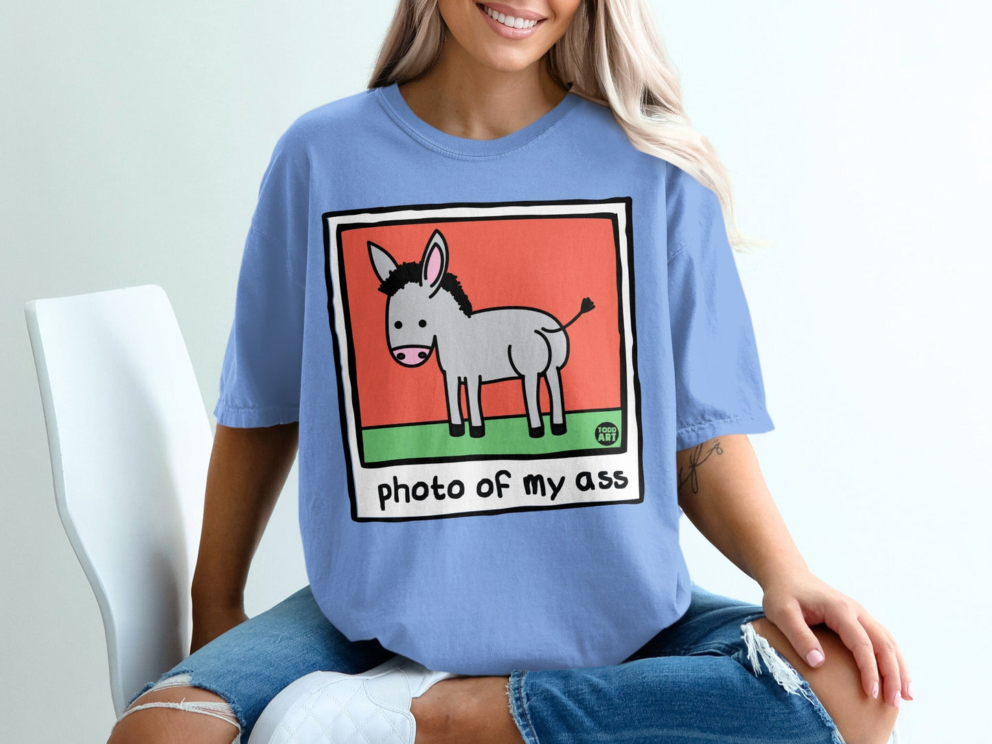Illustration of a donkey on a T-shirt with text "photo of my ass".